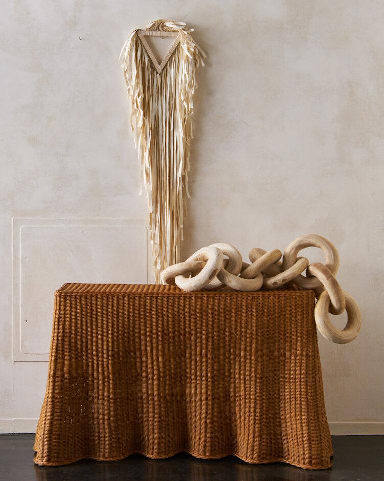 A dramatic Trompe l’Oeil “Ghost” wicker console featuring a draped Silhouette. 

Dimensions: 45