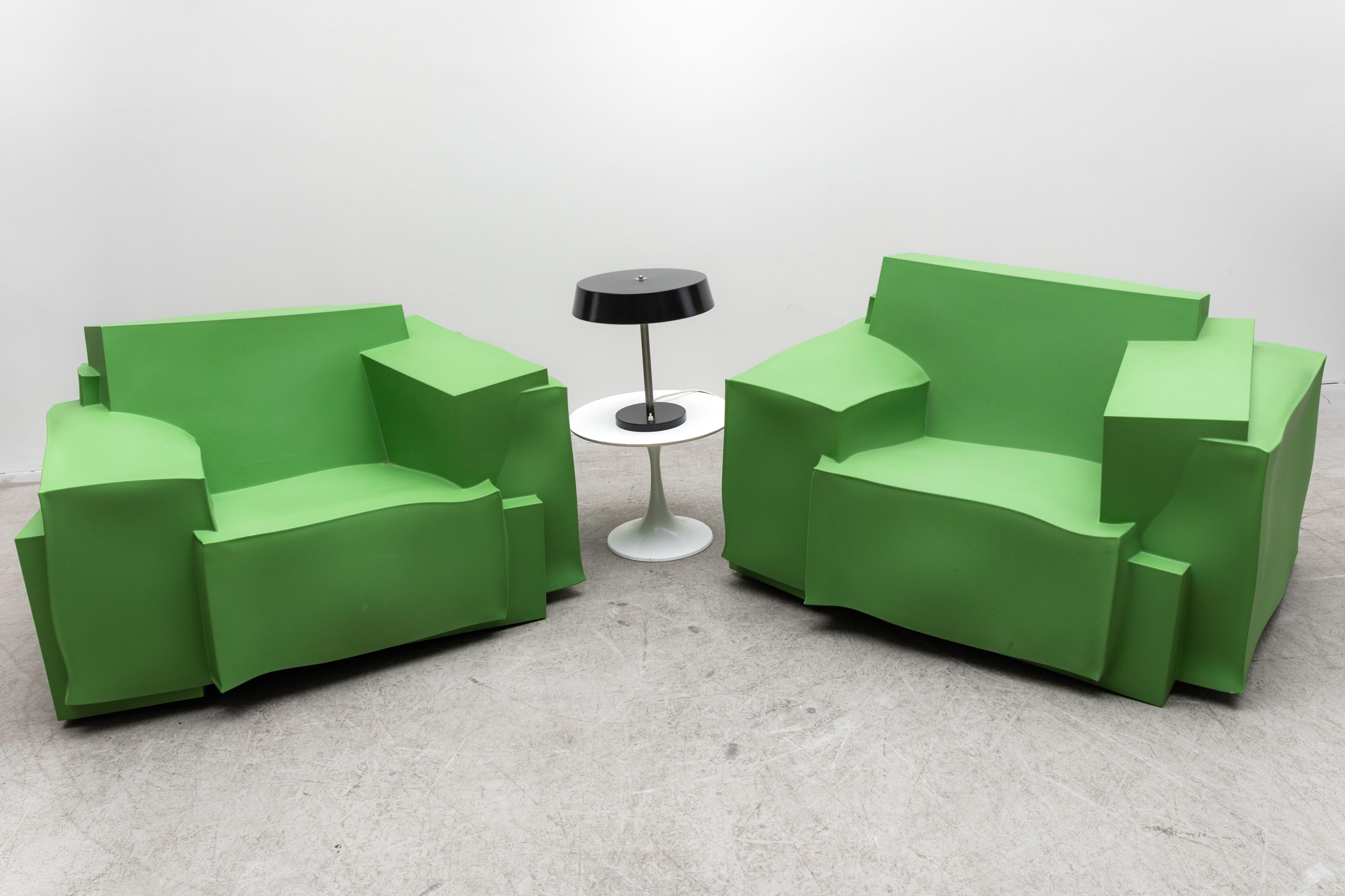 'The TRON' armchair by Dror Benshetrit for Cappellini in Collaboration with Walt Disney. Green molded plastic armchairs with bold lines inspired by the digital landscape of the outland terrain in Walt Disney’s pictures 2010 film Tron: legacy! In