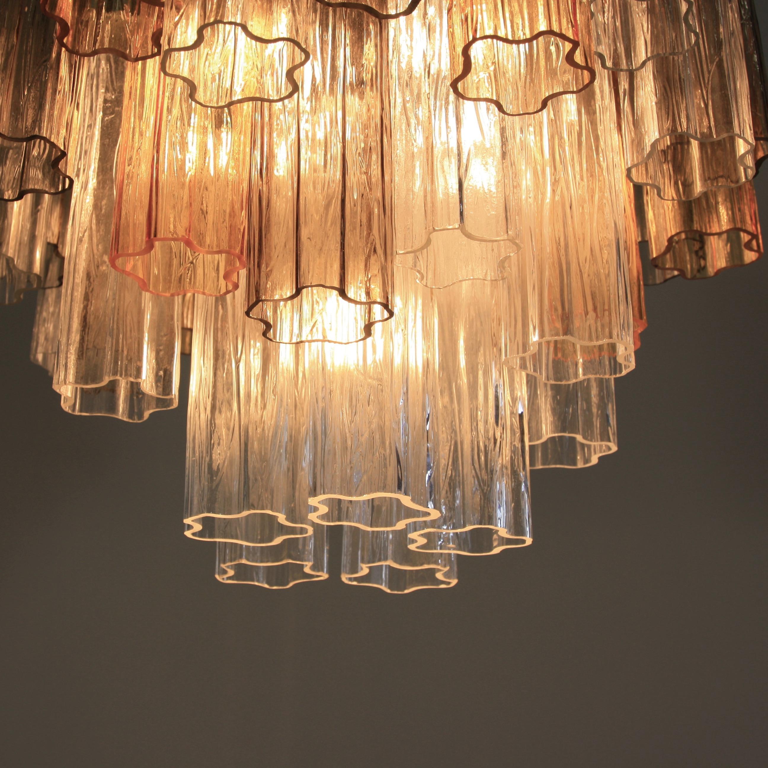 Chandelier with star shaped 'Tronchi' glass pieces, Murano, Italy.

White metal structure with well over 50 Murano glass pieces in yellow, brown and clear. Arranged over three layers. With five-light fittings.