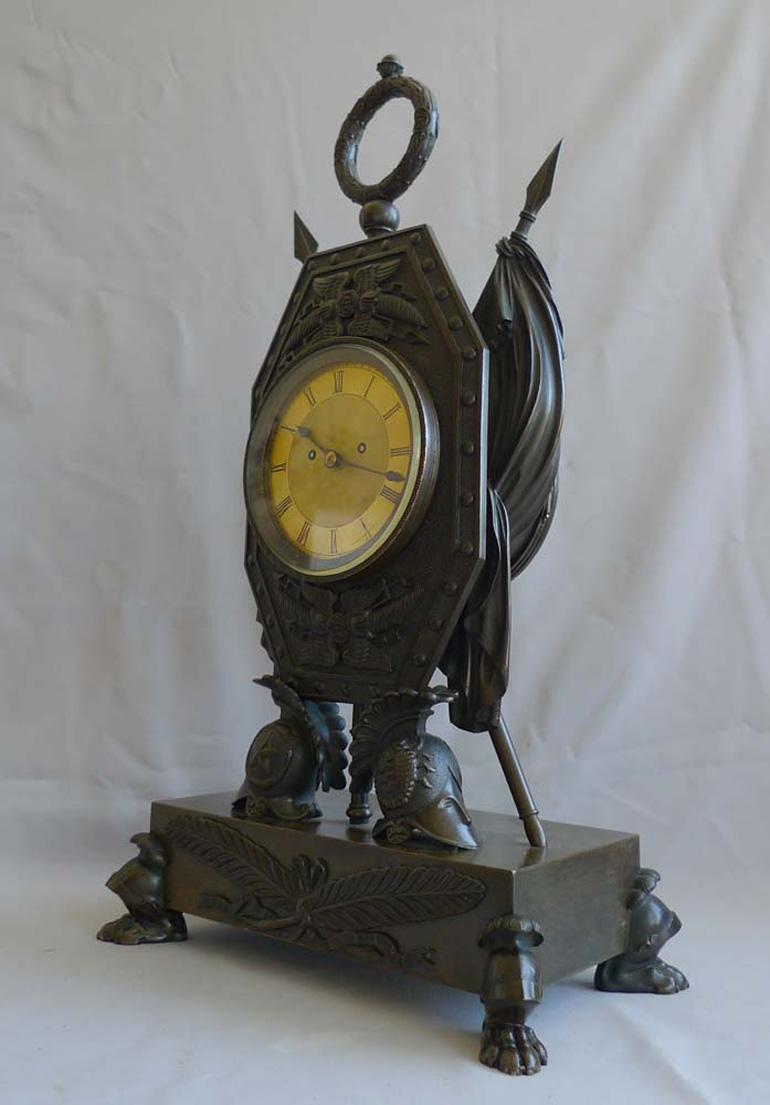 Patinated Trophies of War English Regency Clock by Forrester of Hull For Sale