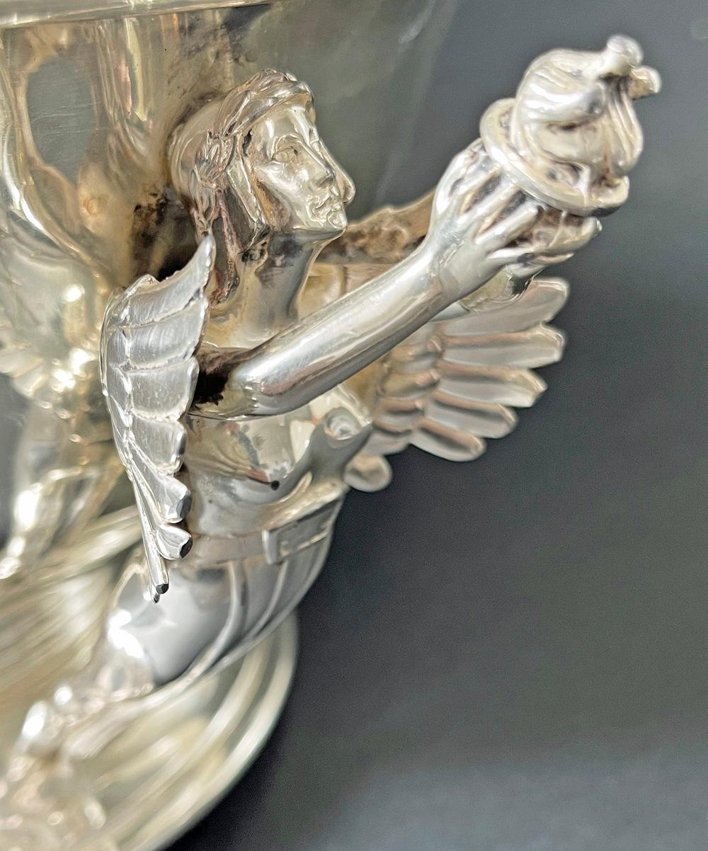A stunning work of art and a significant historic memorial to a great moment in horse racing history, this silver plated bowl by International Silver was given by The National Trotting Association to D. J. McConnville and P. J. Downey in 1938.