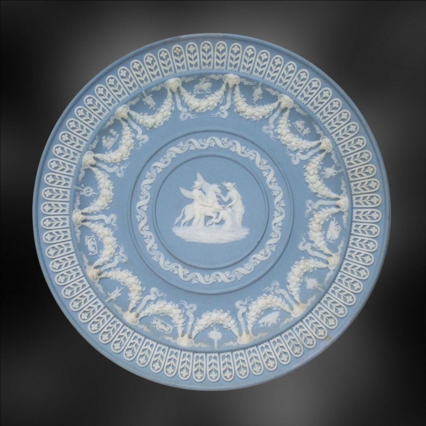 Trophy plates were a particularly Victorian development at Wedgwood, taking the use of classical ornament to its absolute limit. Over 2,000 individual sprigs were made, applied, and undercut to produce this plate. Only the best decorators made