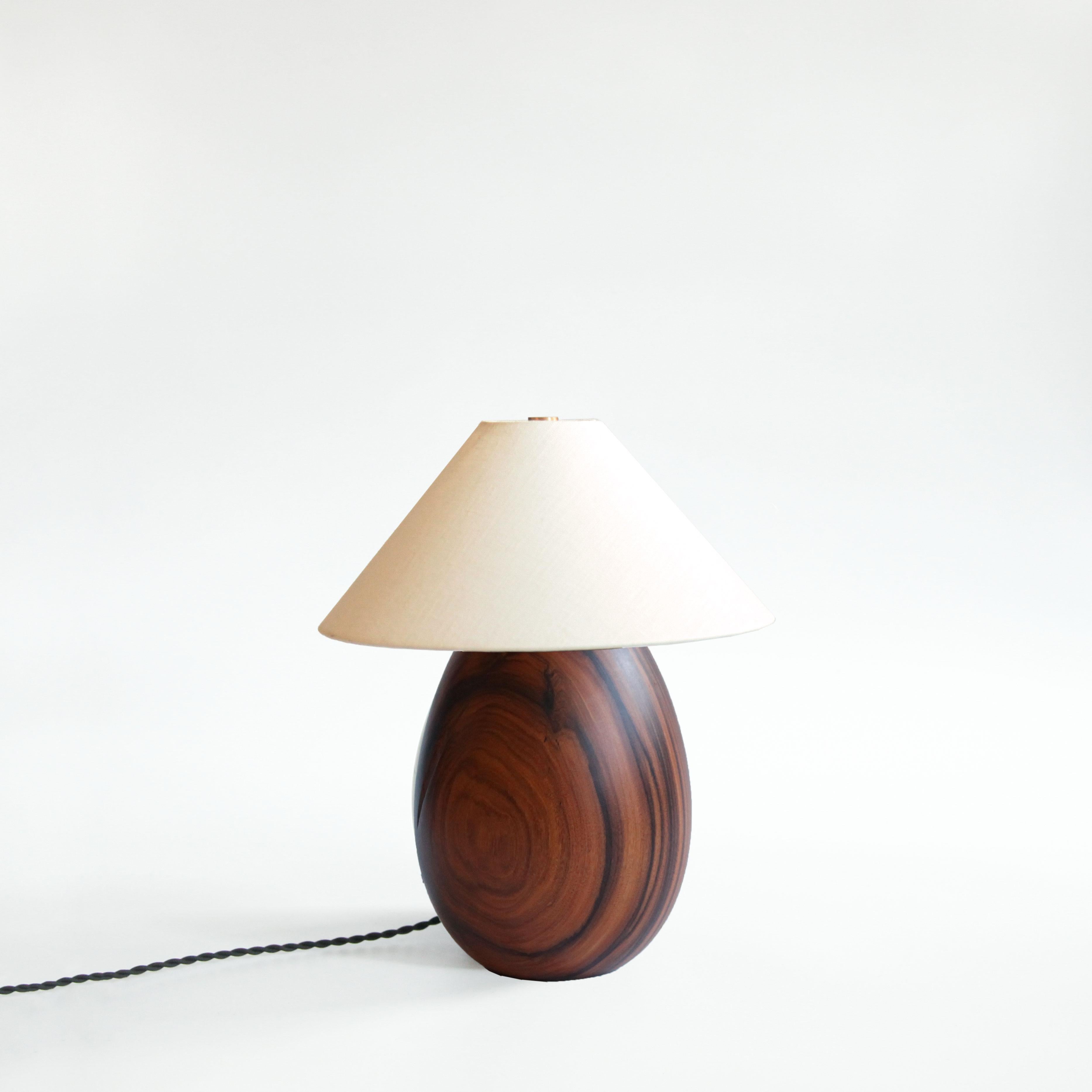 The Árbol collection is an embrace of tropical modernism; each lamp is composed of salvaged tropical hardwoods from the Bolivian city of Santa Cruz, where trees that are felled by natural causes—or for construction—are rescued by our team. A blend