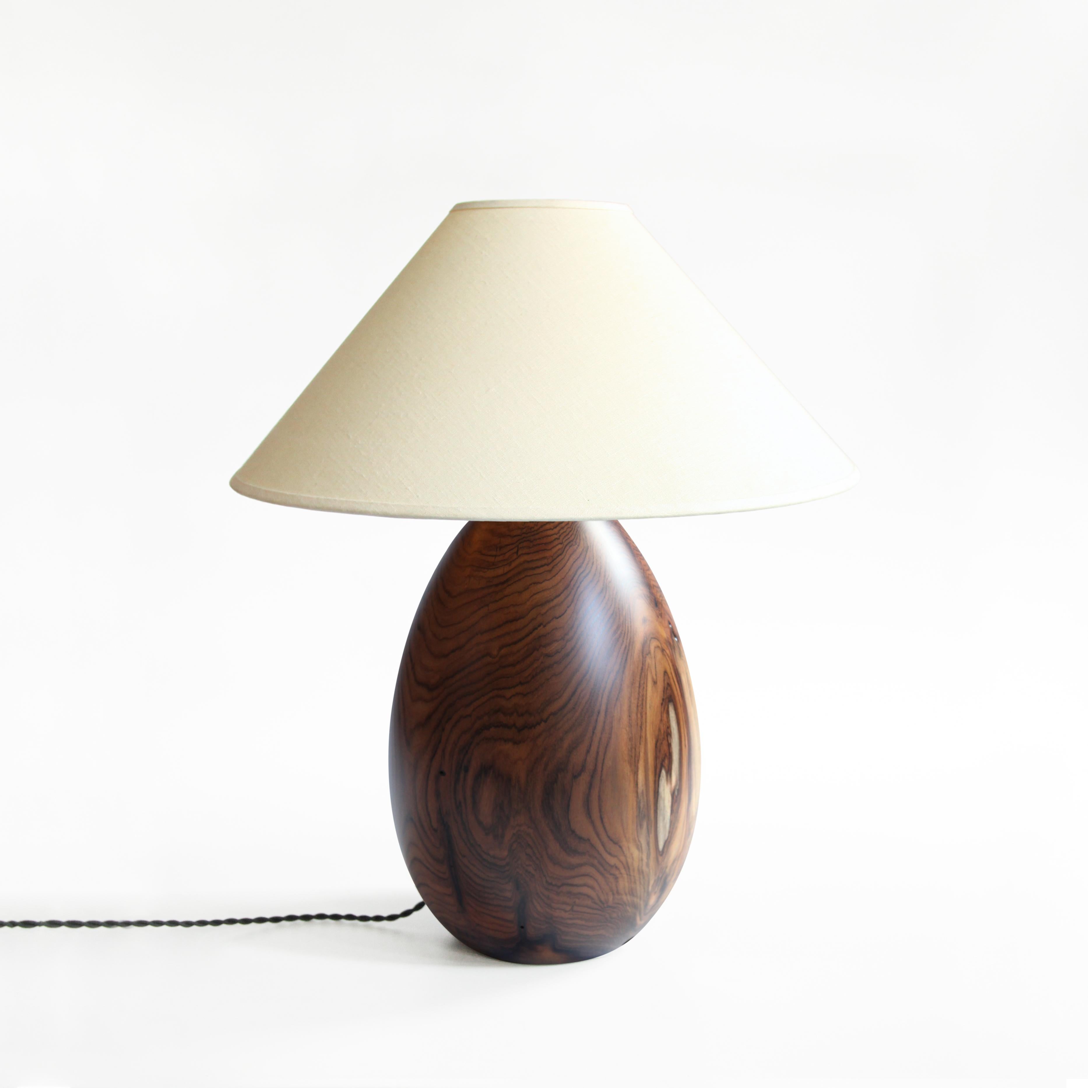 The Árbol collection is an embrace of tropical modernism; each lamp is composed of salvaged tropical hardwoods from the Bolivian city of Santa Cruz, where trees that are felled by natural causes, or for construction are rescued by our team. A blend