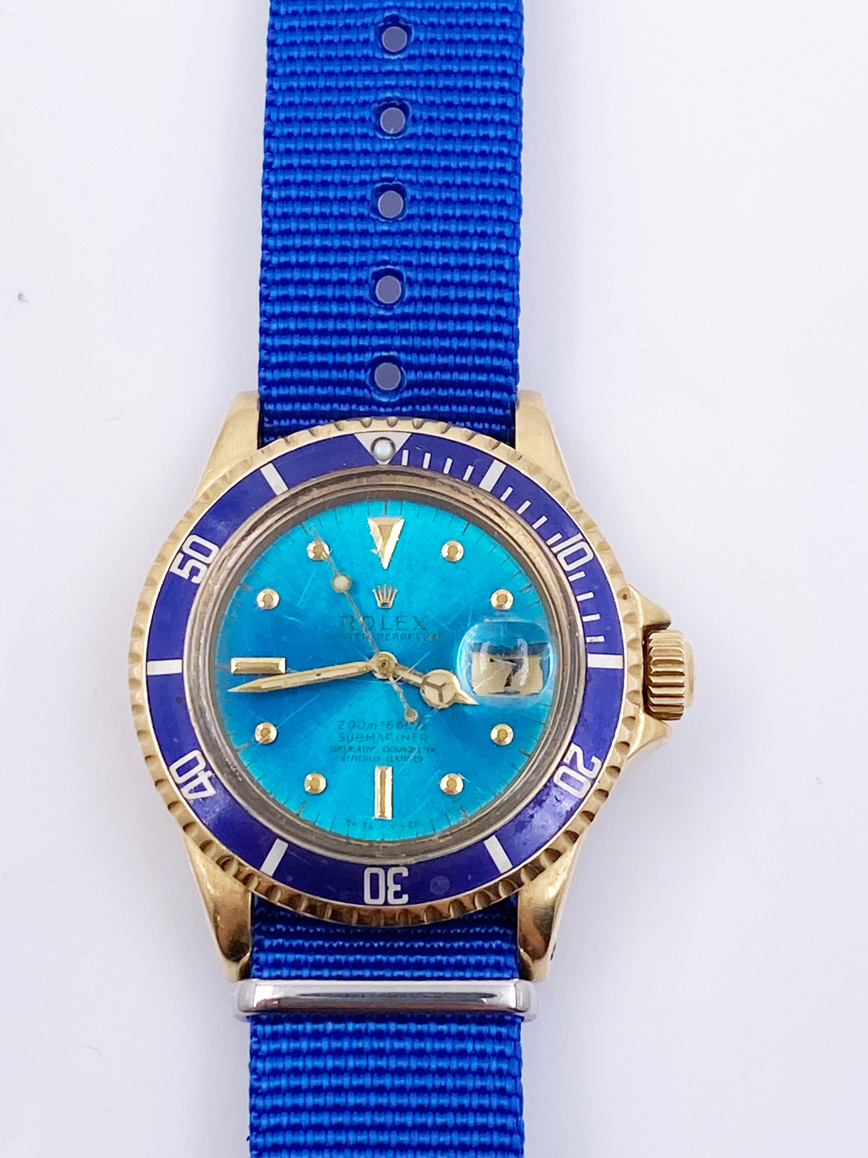 Style Number: 1680

 

Serial: 5835***



Year:1979

 

Model: Submariner 

 

Case Material: 18K Yellow Gold



Band: Custom Blue Nato Strap

 

Bezel:  Blue

 

Dial: TROPICAL NIPPLE DIAL - Blue

 

Face: Acrylic 

 

Case Size: 40mm

 

Includes: