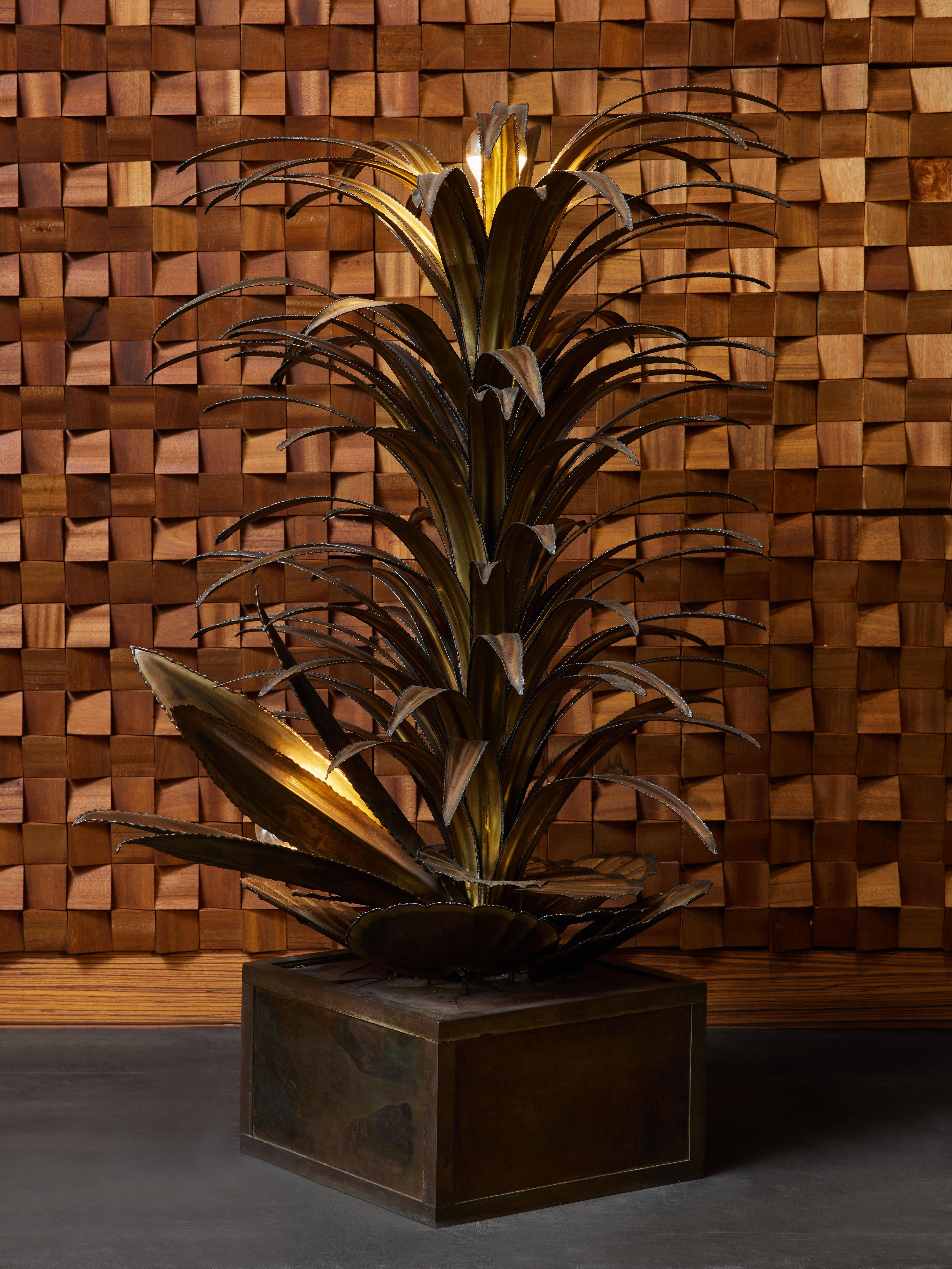 Small floor lamp made by Maison Jansen, made of a square brass and resin base, brass water lilies, and two other tropical plants, each holding one source of light.