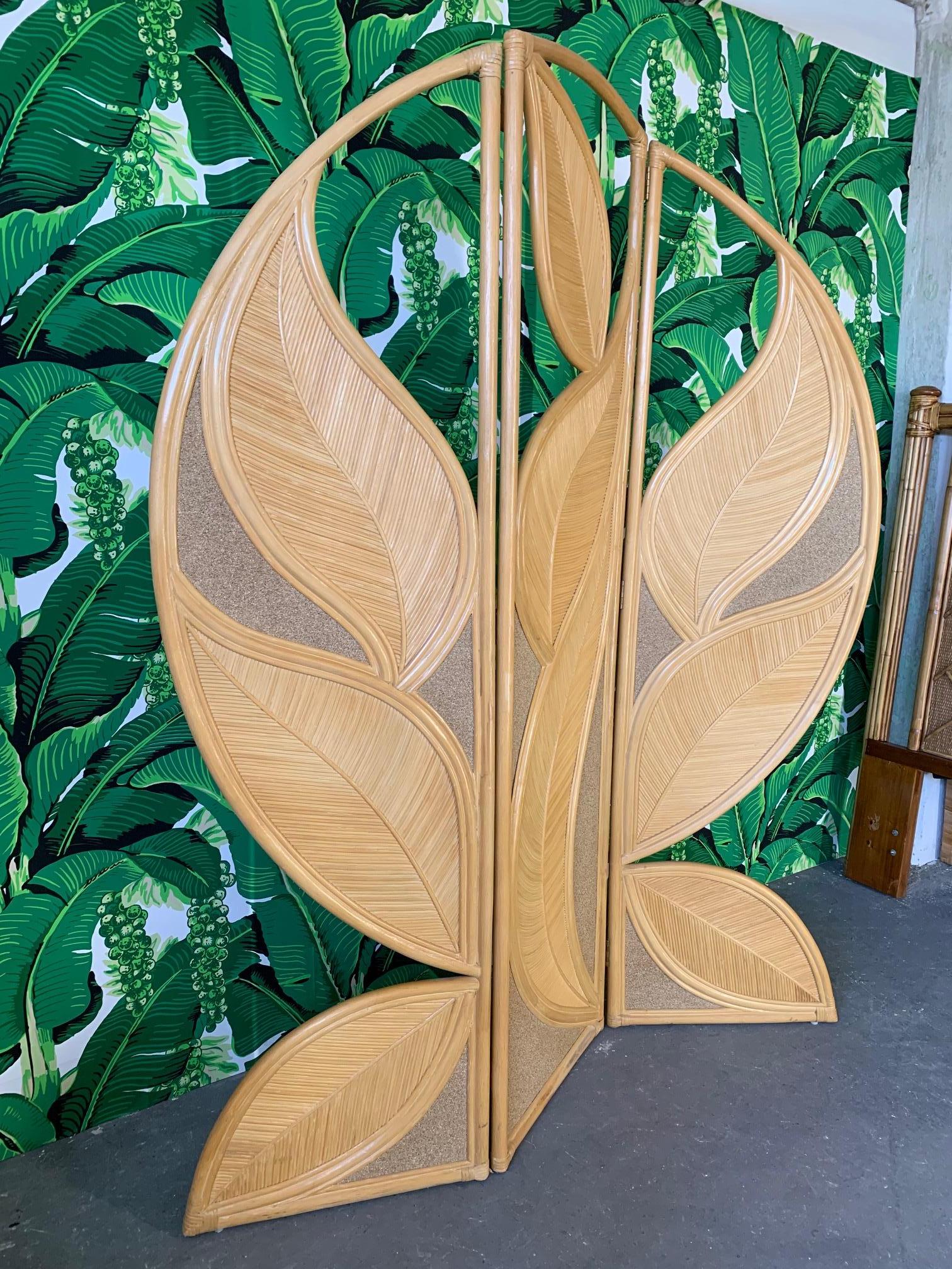 One of a kind rattan leaf-shaped vintage folding screen. Very heavy and sturdy, this unique screen will be your favourite statement piece whether used as a room divider or an accent piece along a wall. Measures 80.5