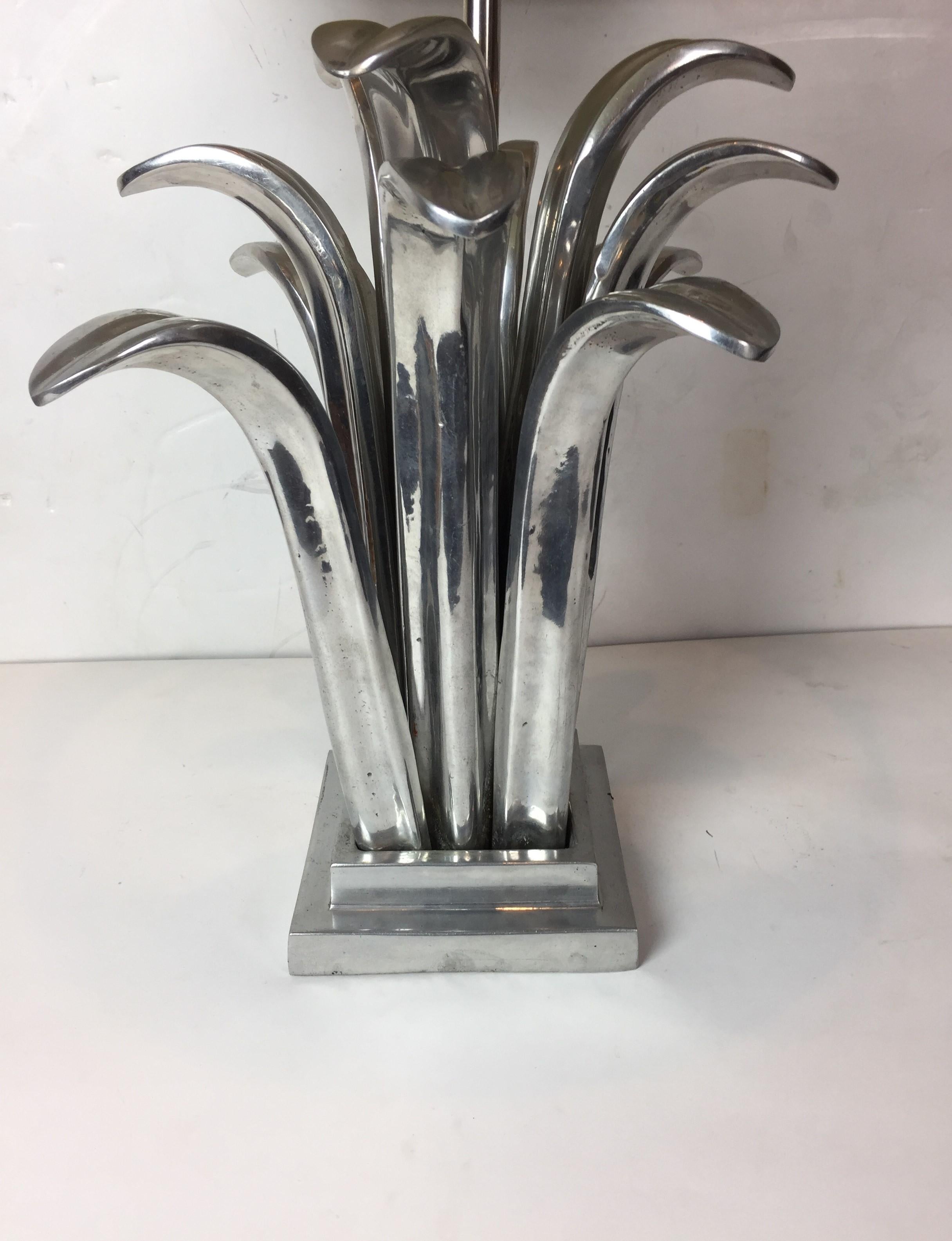 Tropical-style pewter table lamp. The lamp is 25