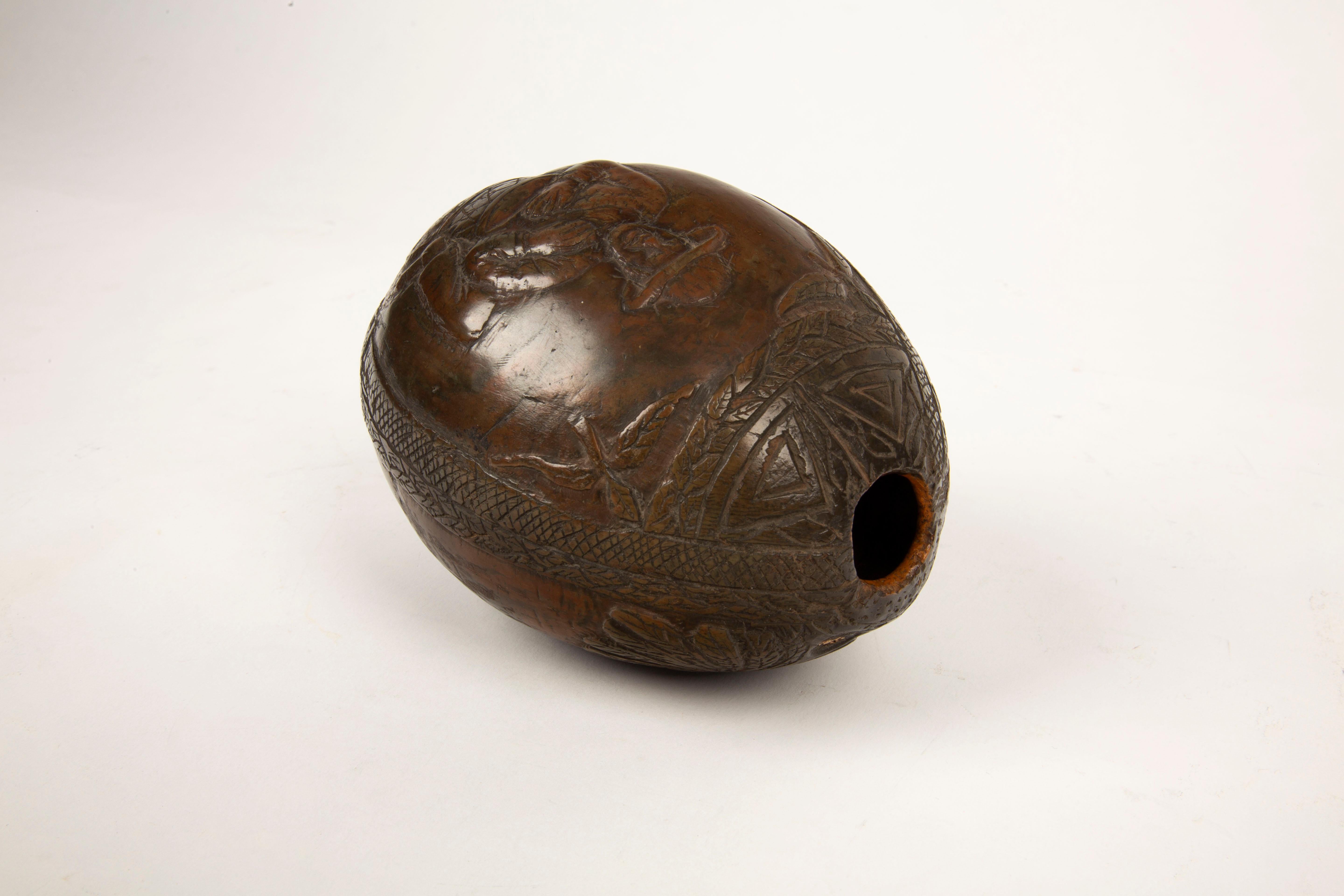 Hand-Carved Tropical Tales: Rare 19th-Century French Colonial Carved Coconut Flask For Sale