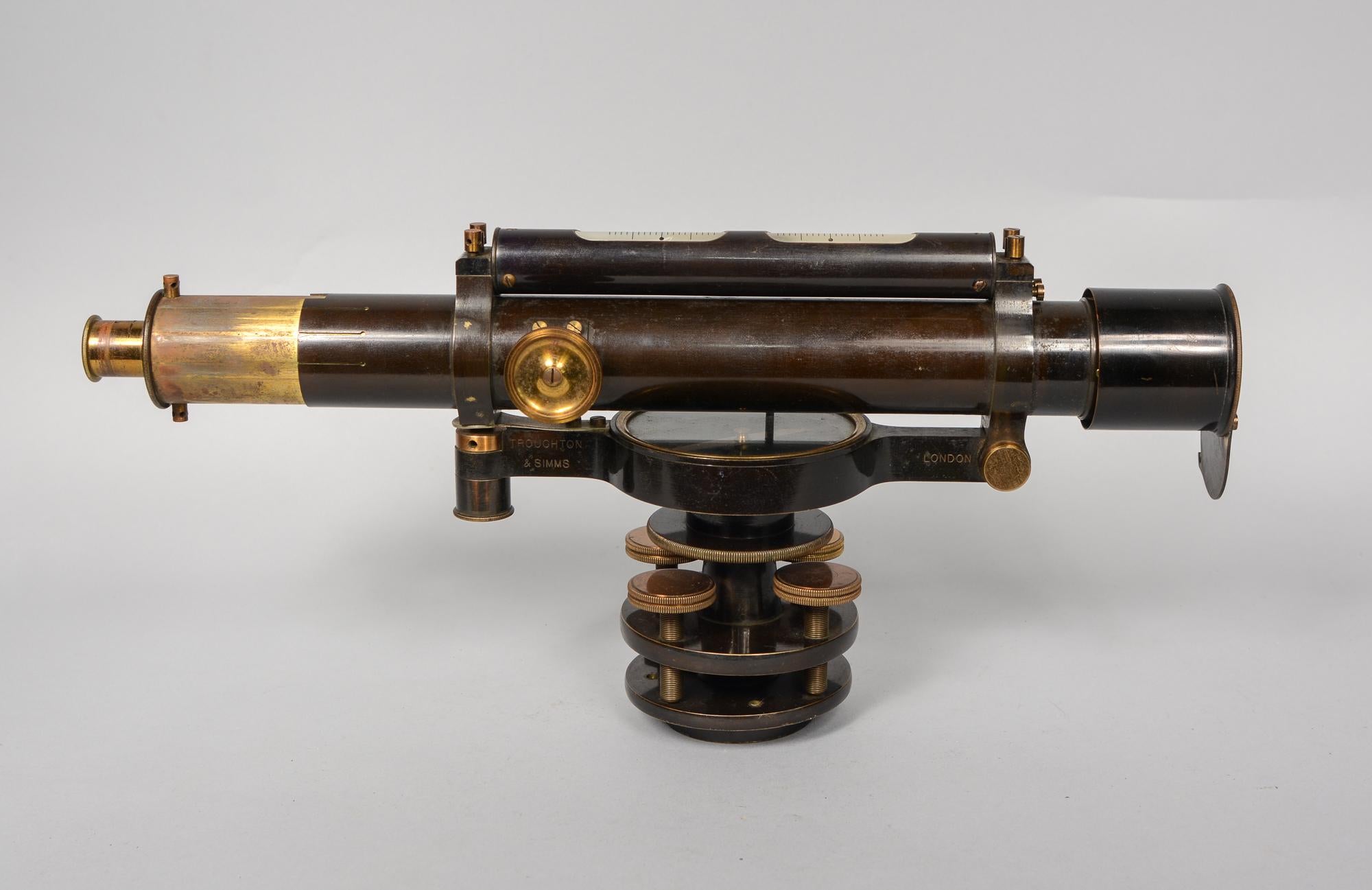 Early 20th century surveyor's level made be Troughton and Simms of London. This comes in its original mahogany case. The dimensions listed are for the case. The level measures 3.75 inches deep, 7 inches tall and 13 inches long with the tubes