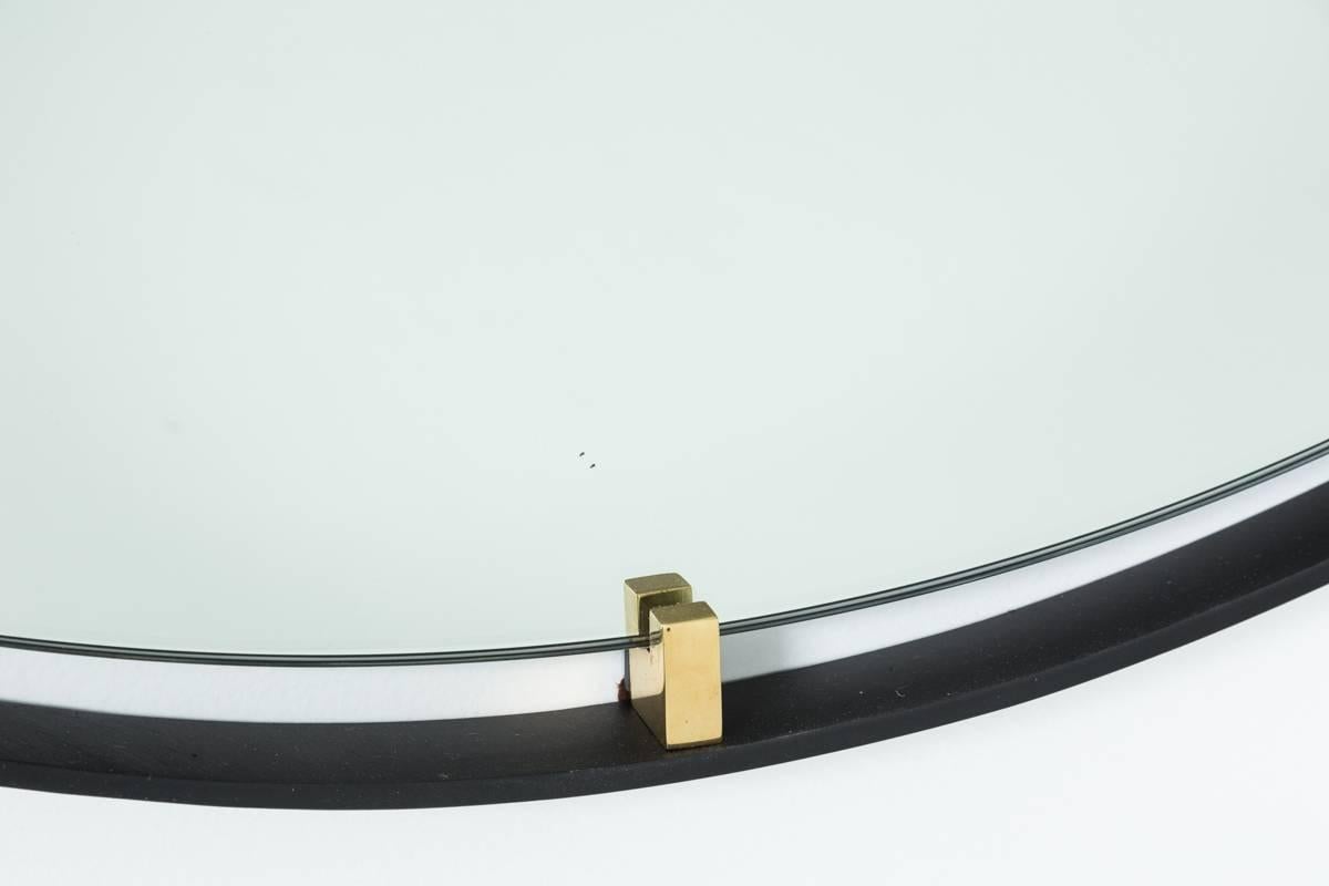 Outlined by a thin steel frame and held in place with solid brass clasps the Trousdale mirror is beautiful in any room. 
Custom sizes and finishes available.

Available sizes: 
30