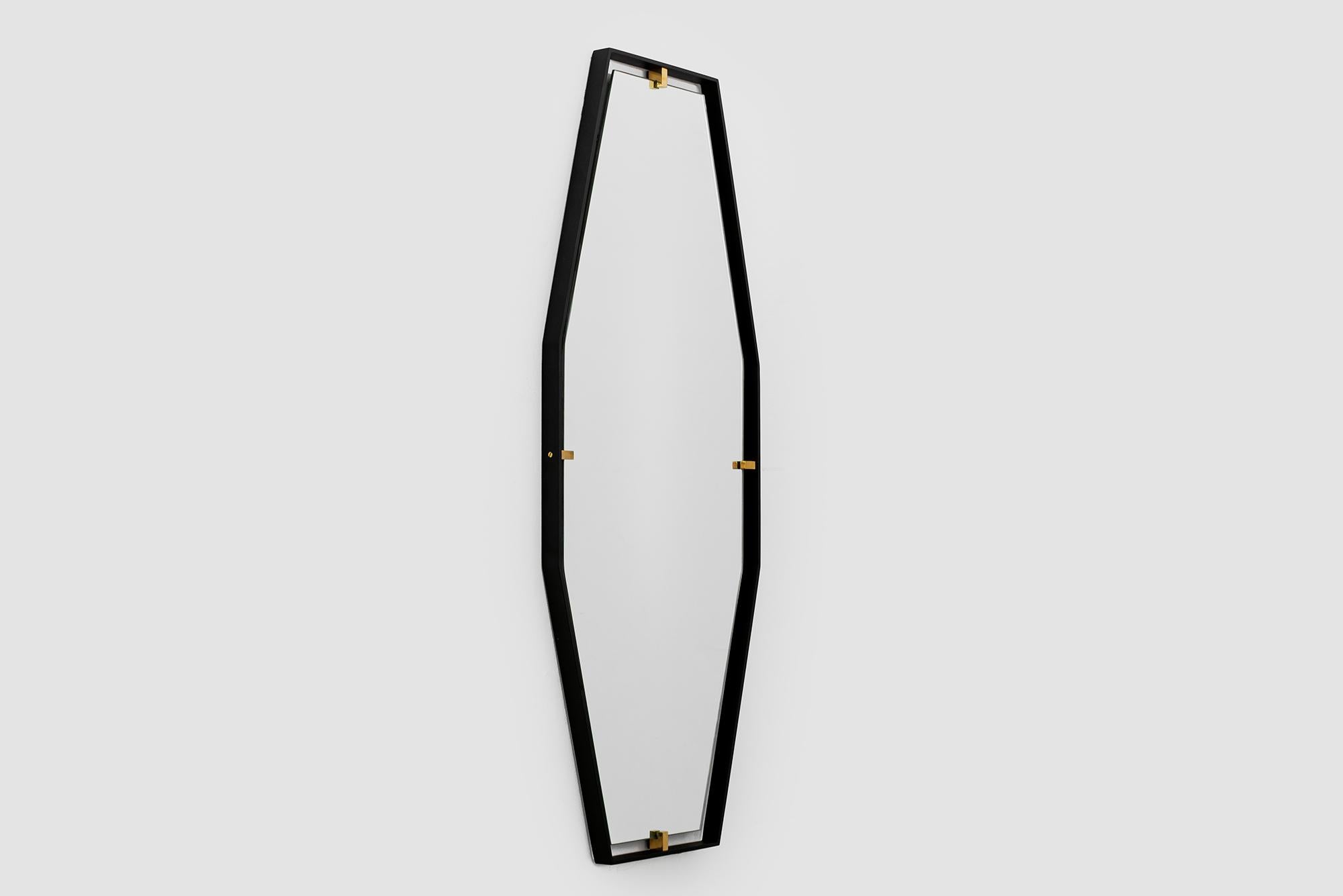 Outlined by a thin steel frame and held in place with solid brass clasps the Trousdale mirror is beautiful in any room.  

Custom sizes and finishes available. 

Made in Los Angeles 