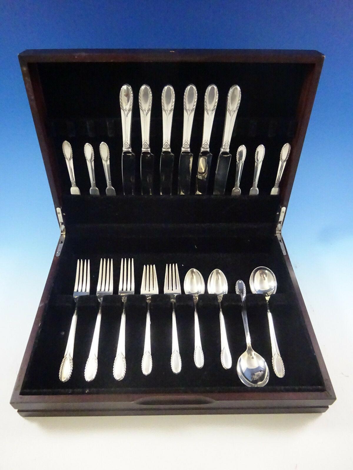 Stunning Trousseau by International Sterling Silver flatware set - 36 pieces. This set includes:

6 knives, 9 1/8