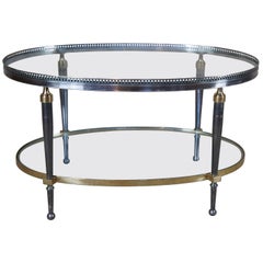 Trouvailles Hollywood Regency Couchtisch mit ovaler Glasplatte aus Silber und Messing