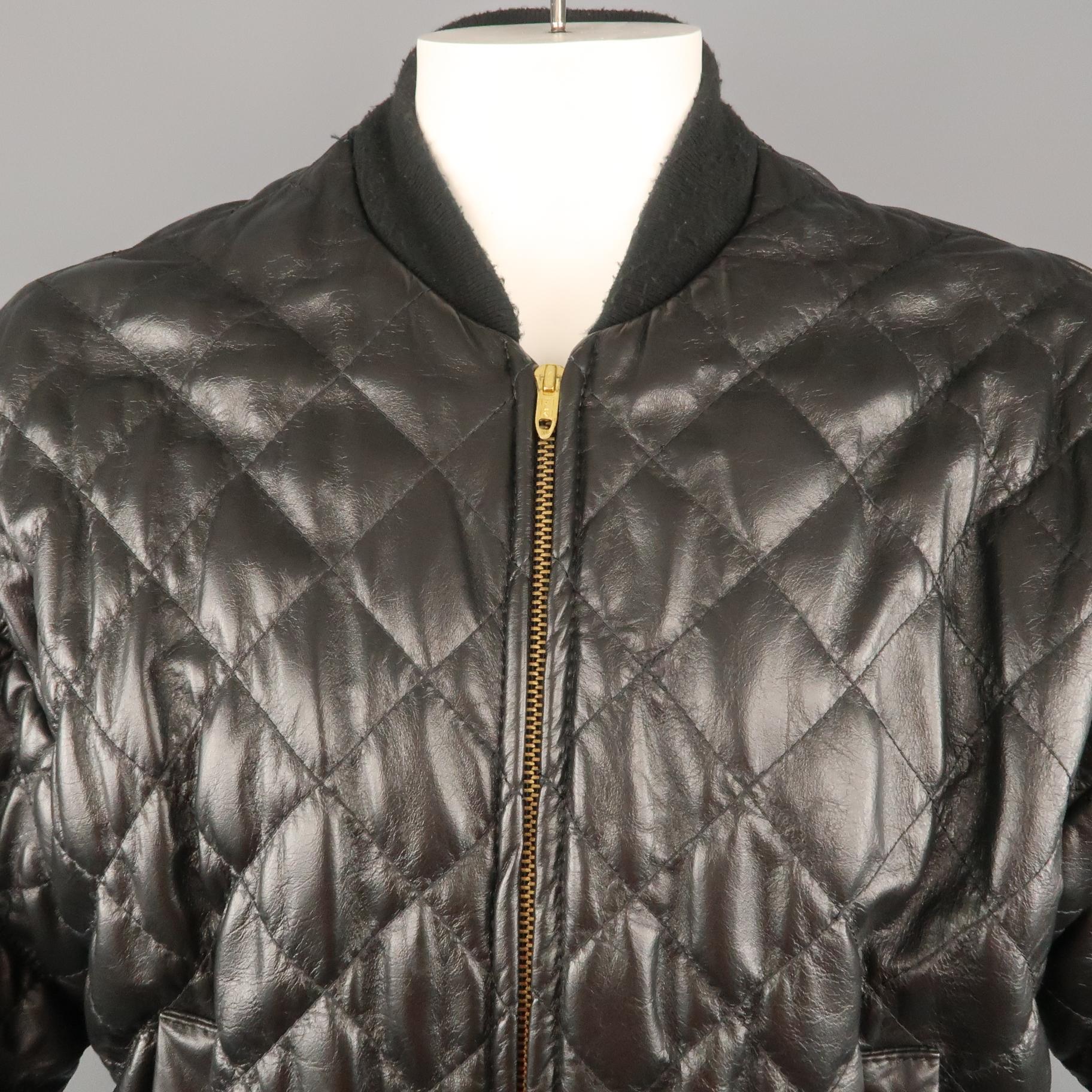TROY ANICETE jacket comes in a black quilted leather featuring a bomber style with a full zip closure. Custom made. (As Is).
 
Good Pre-Owned Condition.
Marked: (No size)
 
Measurements:
 
Shoulder: 22 in.
Chest: 48 in.
Sleeve: 22 in.
Length: 24 in.