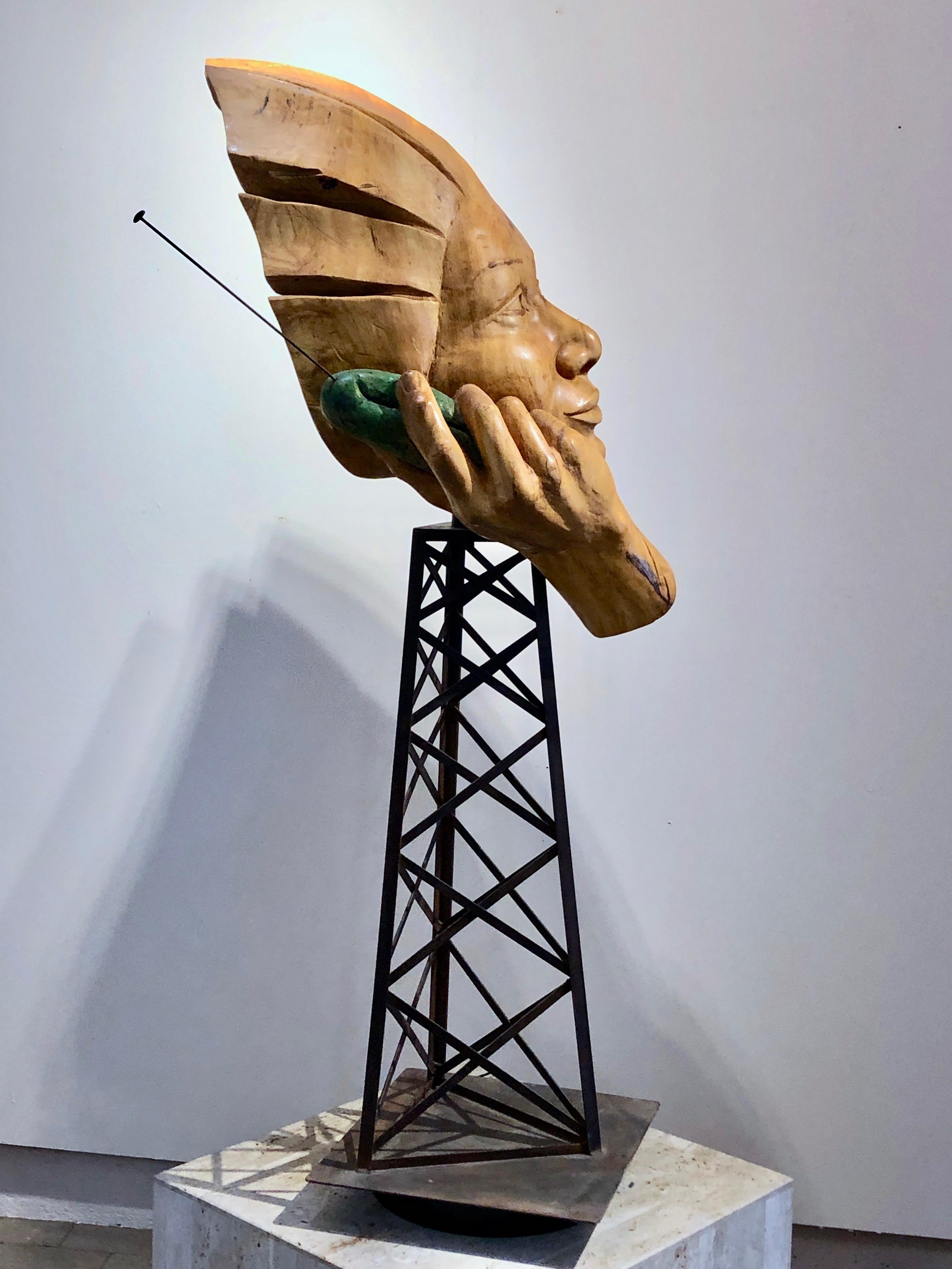 Disconnect, wood sculpture by Troy Williams, telephone, cell phone tower, steel

Hand-carved wood bust on a fabricated steel cell phone tower. The figure is talking into a cell phone, actually a pickle.