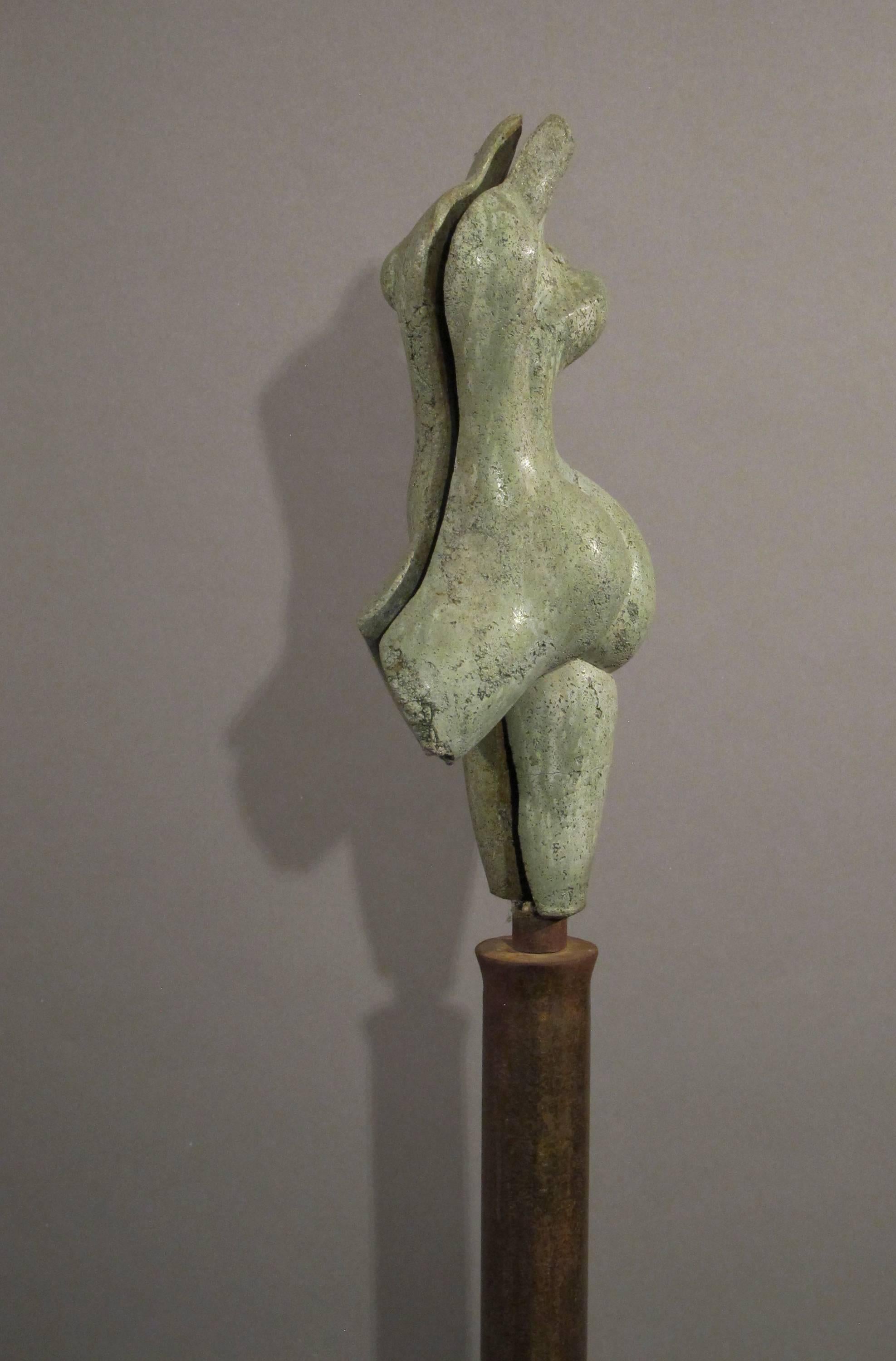 Sunrise, green concrete female nude form on steel column 1