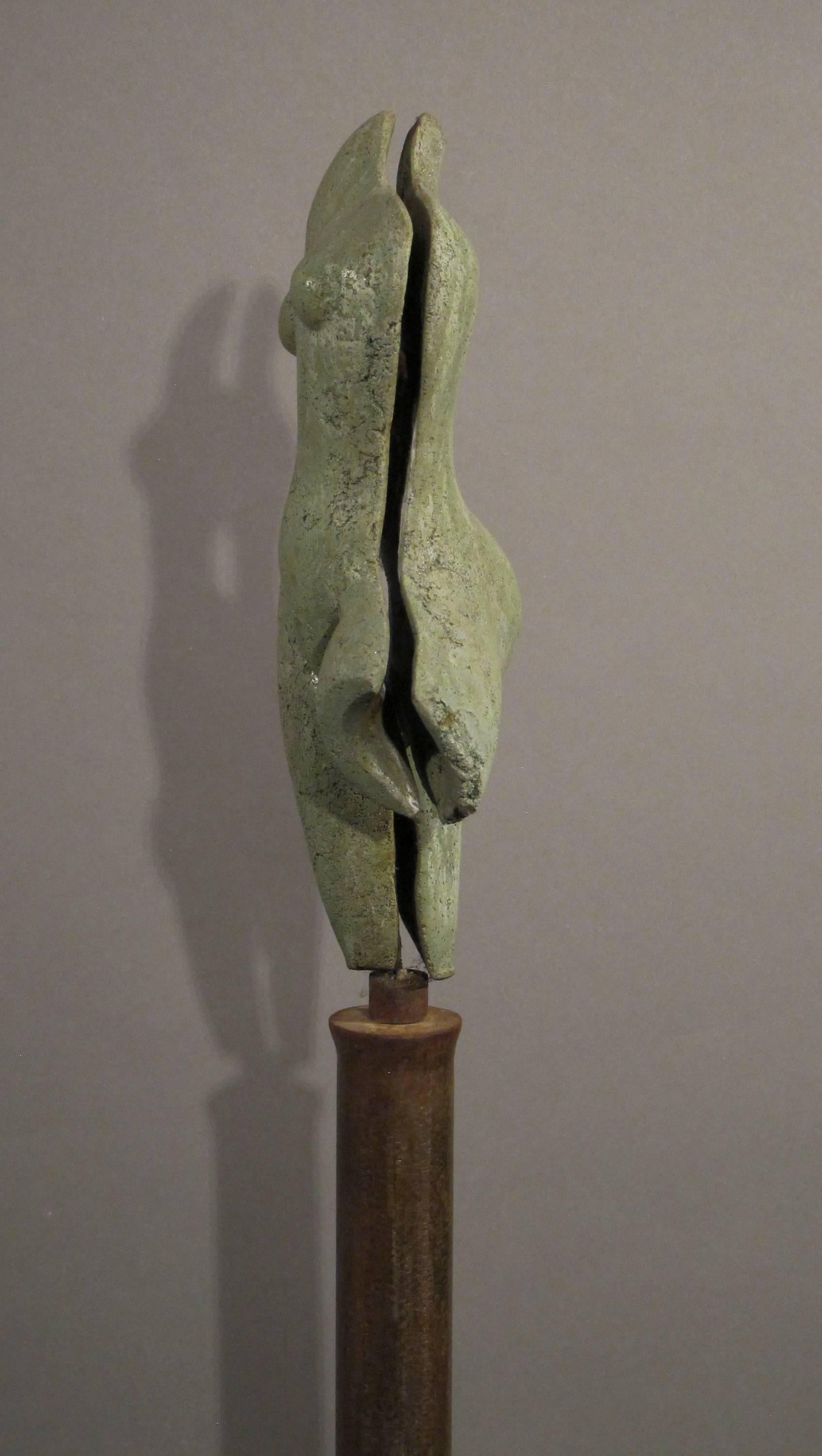 Sunrise, green concrete female nude form on steel column 2