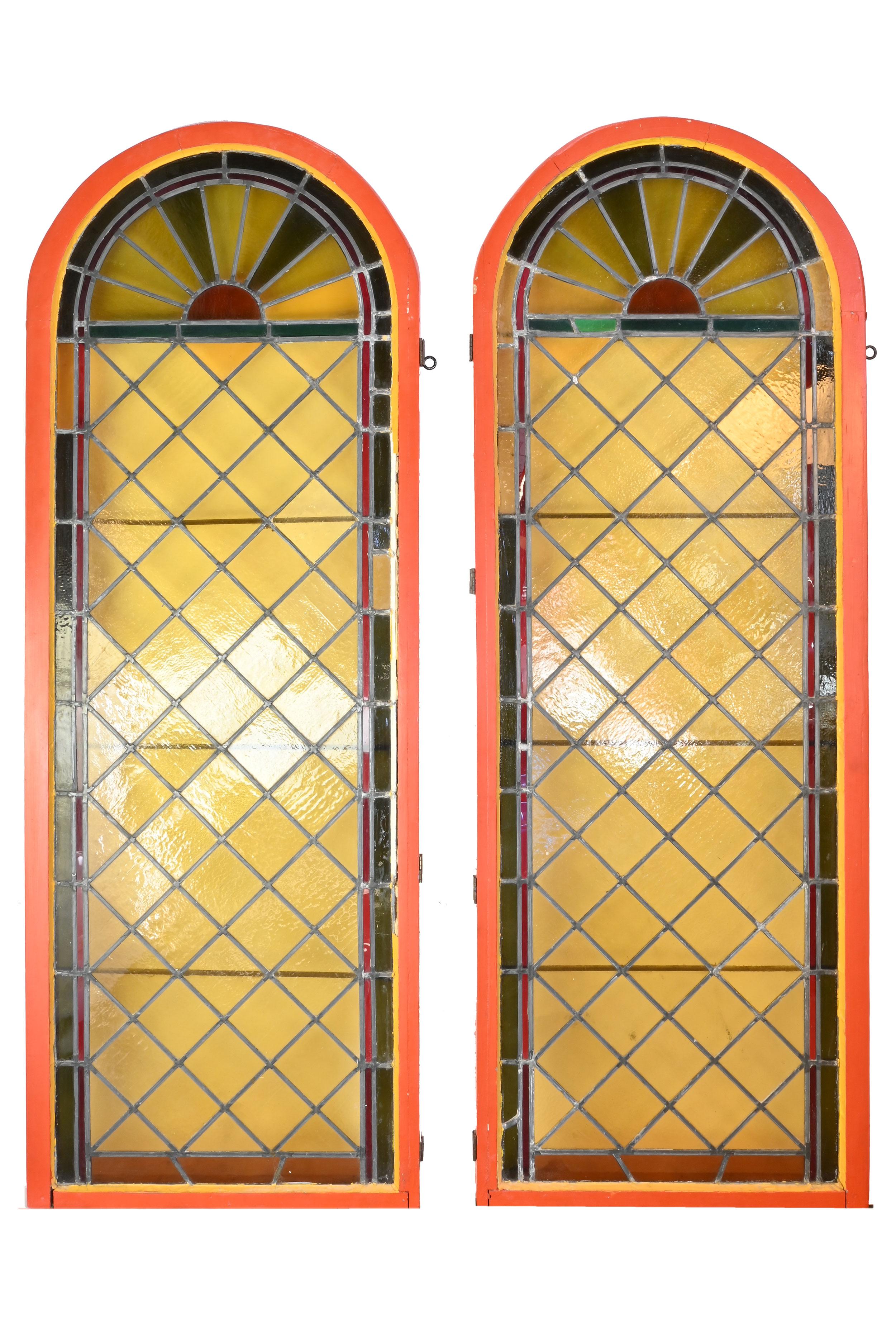 Incredible color and texture from these Amazing arch topped Victorian Sunburst windows, in frame. Every light that comes through creates its own glow through the gradient of the colored glass.

2 available, sold separately

AA# 61011
Circa: