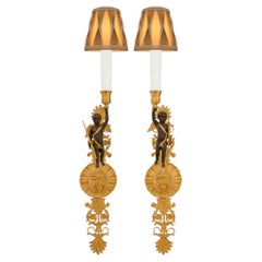 True Pair of French 19th century Empire st. patinated Bronze and Ormolu sconces