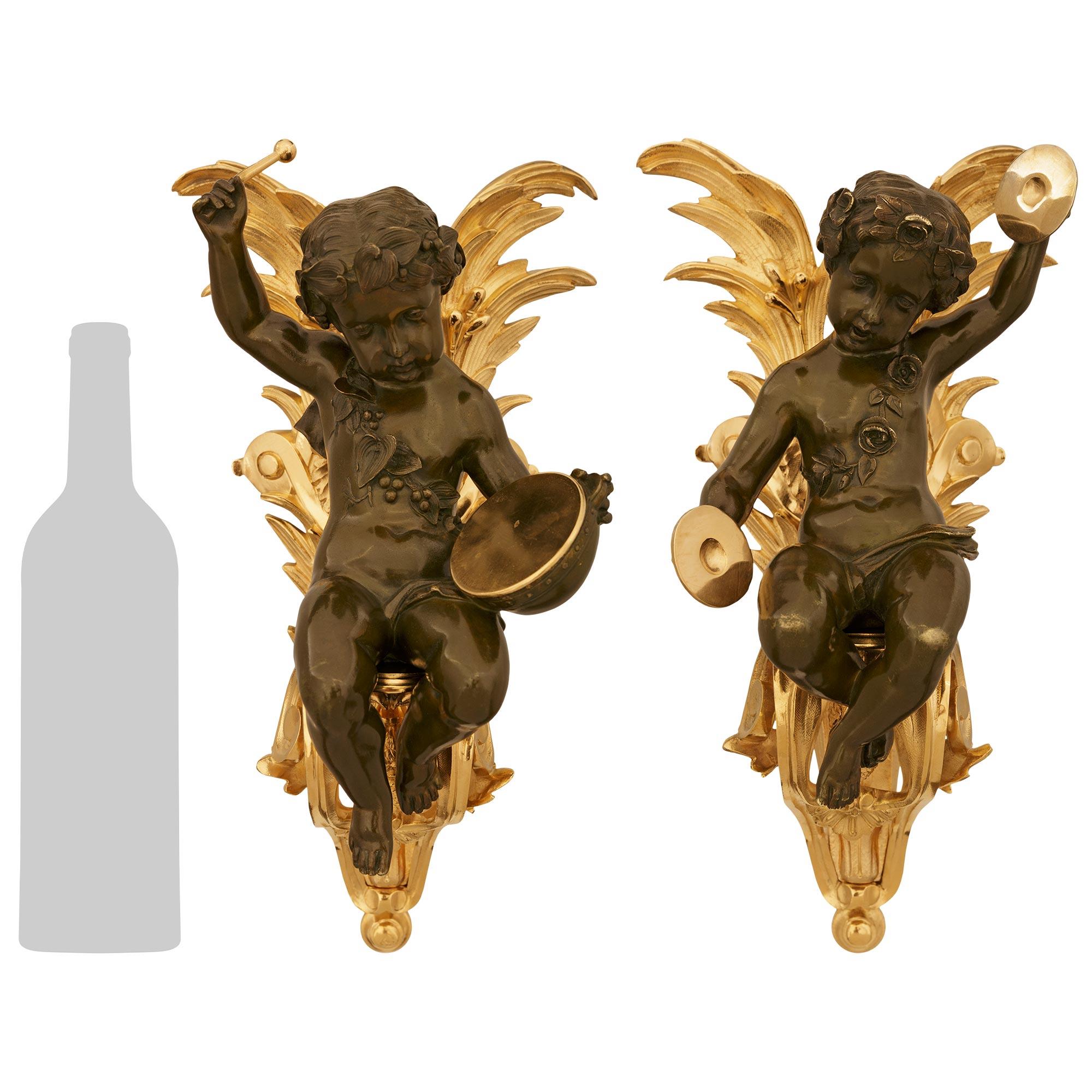 true pair of French 19th century Louis XVI Bronze and Ormolu Cherub wall decor In Good Condition For Sale In West Palm Beach, FL
