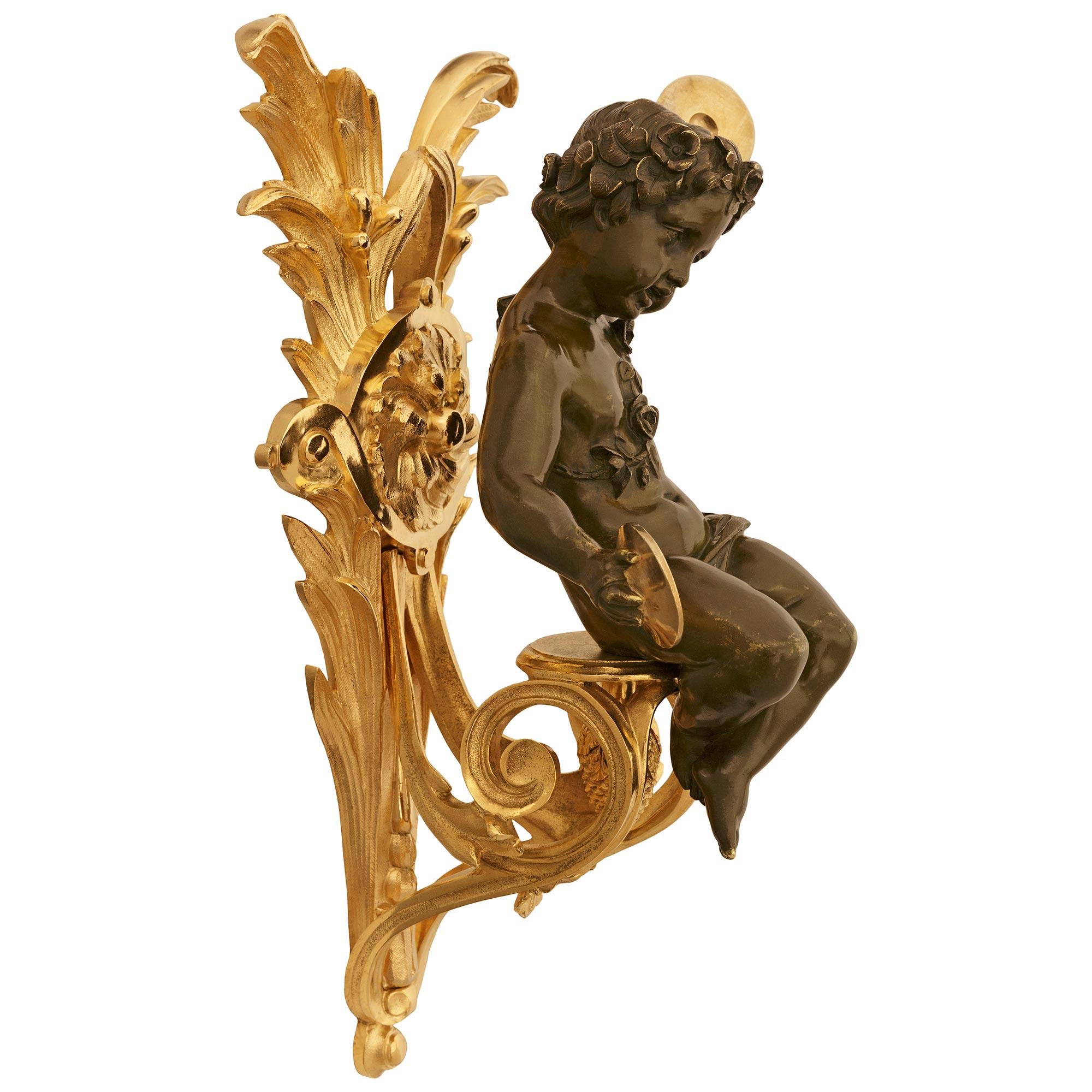 true pair of French 19th century Louis XVI Bronze and Ormolu Cherub wall decor For Sale 1