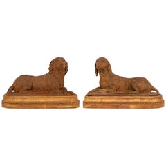 Paire de statues françaises Louis XVI du 19ème siècle en bois doré et terre cuite