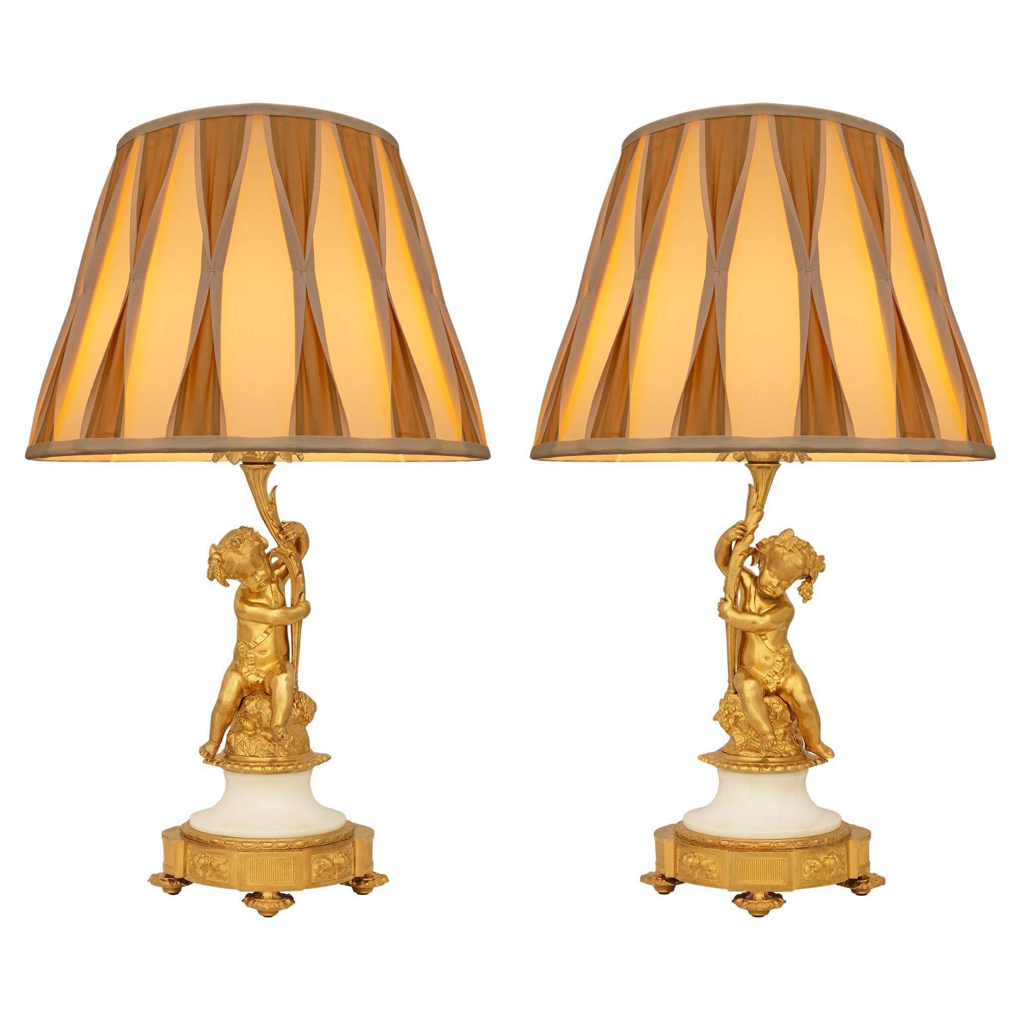 True pair of French 19th century Louis XVI St. Ormolu and Marble Lamps