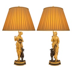 Paire de véritables lampes françaises Louis XVI du 19ème siècle en bronze patiné et ormolu