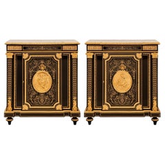 Antique true pair of French 19th century Napoleon III period Ebony and Ormolu cabinets