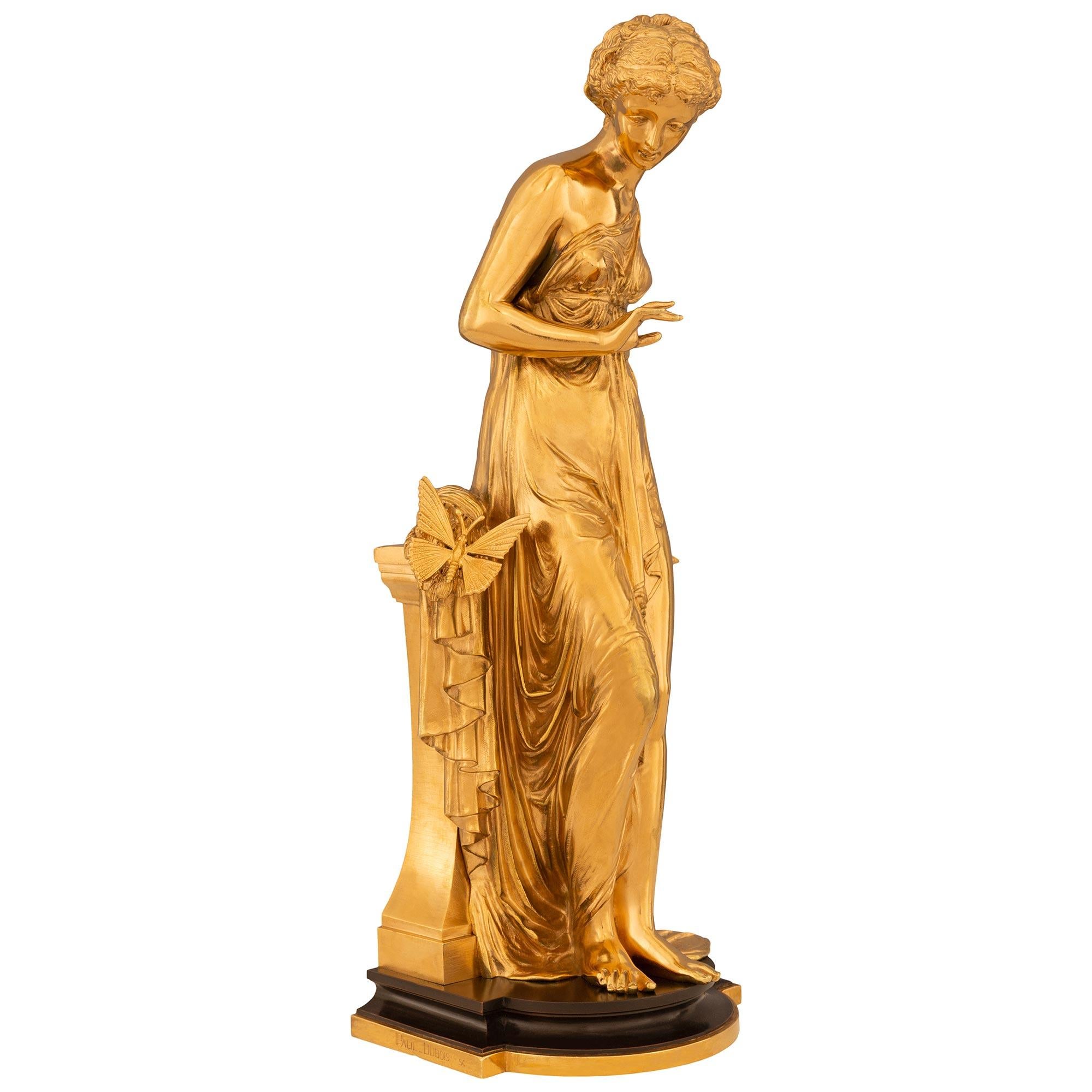 An elegant and high quality true pair of French 19th century Neo-Classical st. Ormolu and patinated Bronze statues, signed Paul Dubois. Each beautiful maiden is raised by an Ormolu and patinated Bronze stepped platform with a curved front. Each