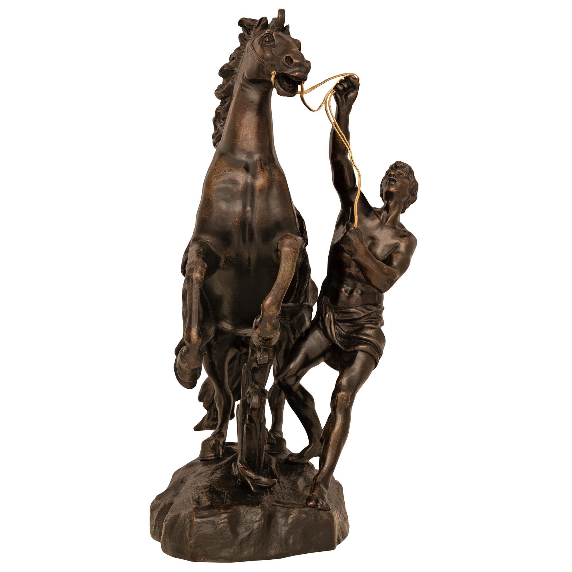 True Pair Of French 19th Century Patinated Bronze Marly Horse Statues In Good Condition For Sale In West Palm Beach, FL