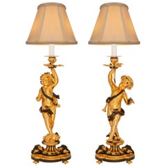 True Pair of French 19th Centurybelle Époque Period Ormolu & Bronze Lamps