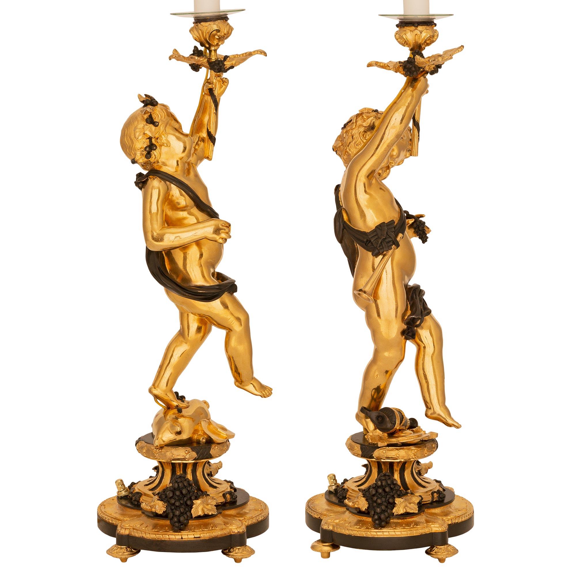 Patinated True Pair of French 19th Centurybelle Époque Period Ormolu & Bronze Lamps For Sale