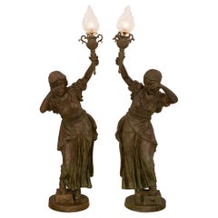 true pair of French Turn of the Century Verdigris Bronze Torchière statues