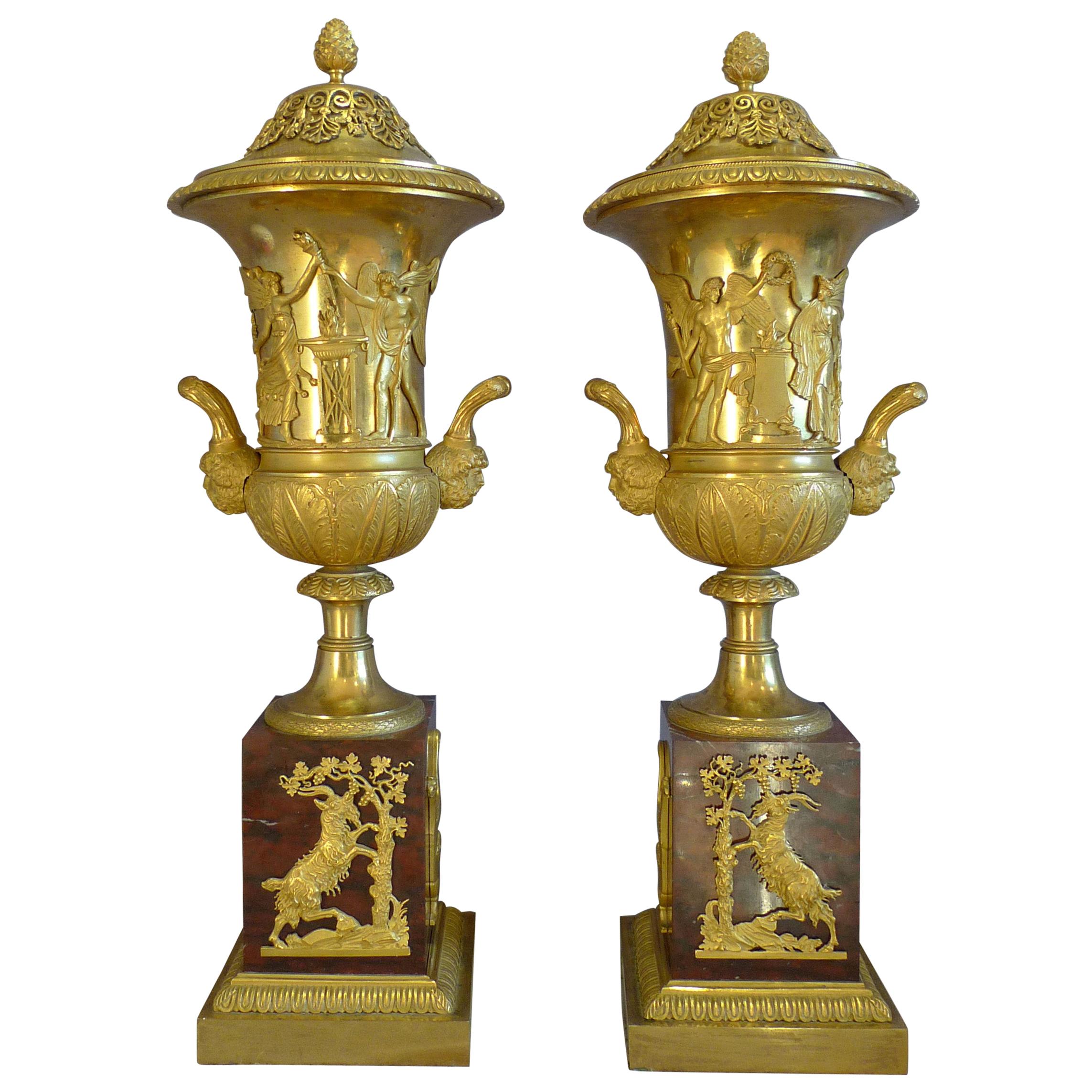 True Pair of Neoclassical Ormolu and Rouge Marble Covered Urns For Sale