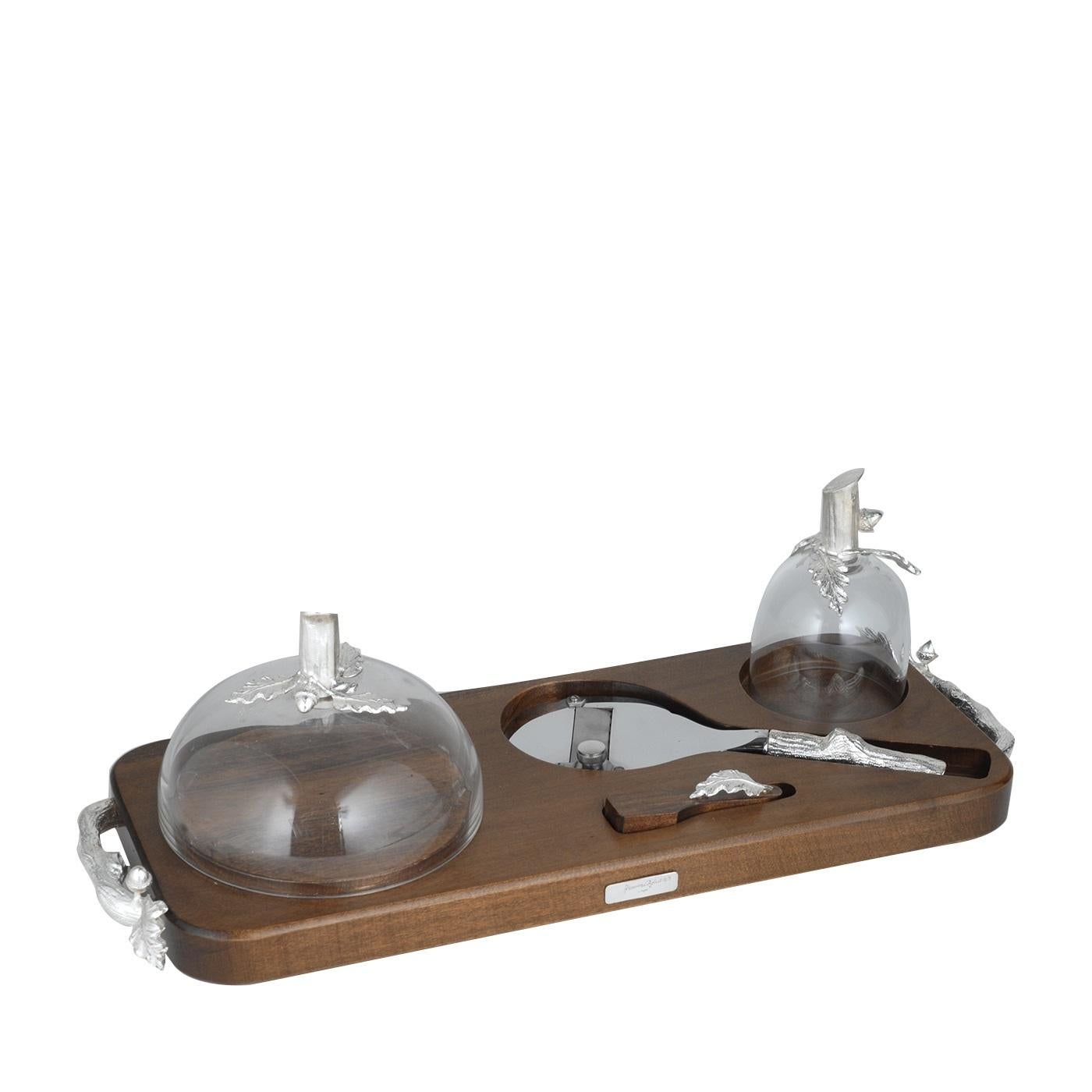 This exquisite truffle and cheese set will be a great gift for a food lover and a splendid addition to any home. Its tray is made of wood and supports two crystal lids (one for cheeses, the other for truffles), one truffle knife, and one truffle