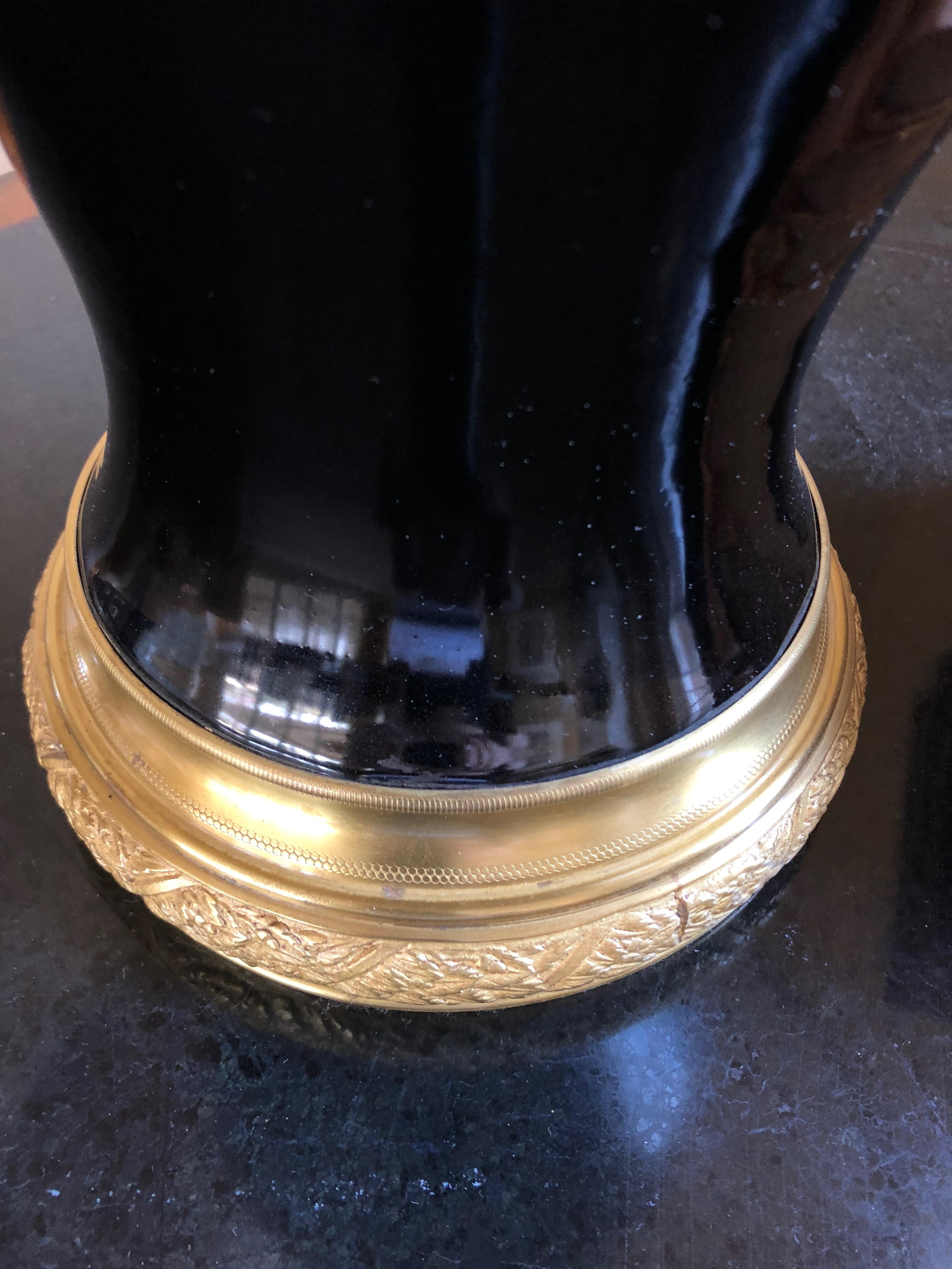 Lovely elegant antique table lamp having a black porcelain vase on brass stand, custom pleated grey silk shade, and ornate pretty finial. Vase is 8 inches diameter.