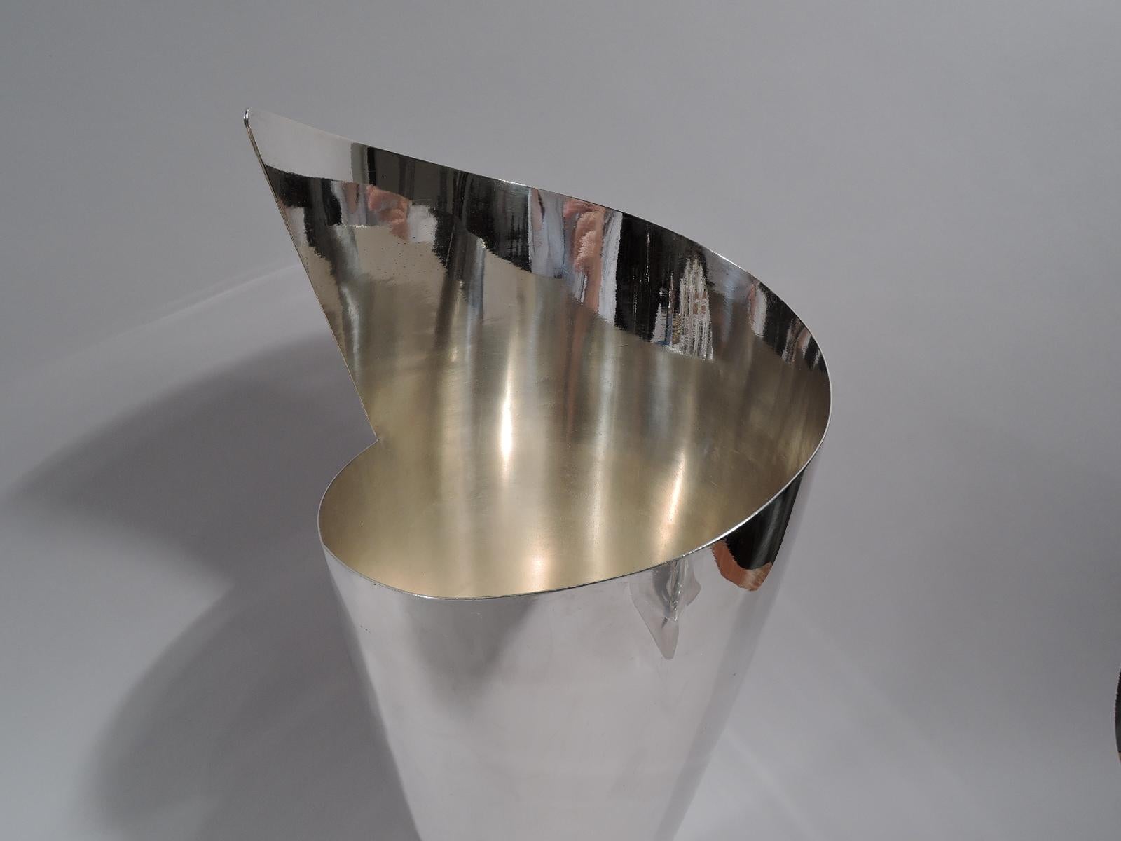 Truly fabulous French Art Deco silver plate vase, circa 1930. A cone mounted to a square. Mouth asymmetrical with cutaway triangle. Swooshing geometry that is suggestive of a paper wrapper. Marked “Desny Paris / Made in France / Déposé”.