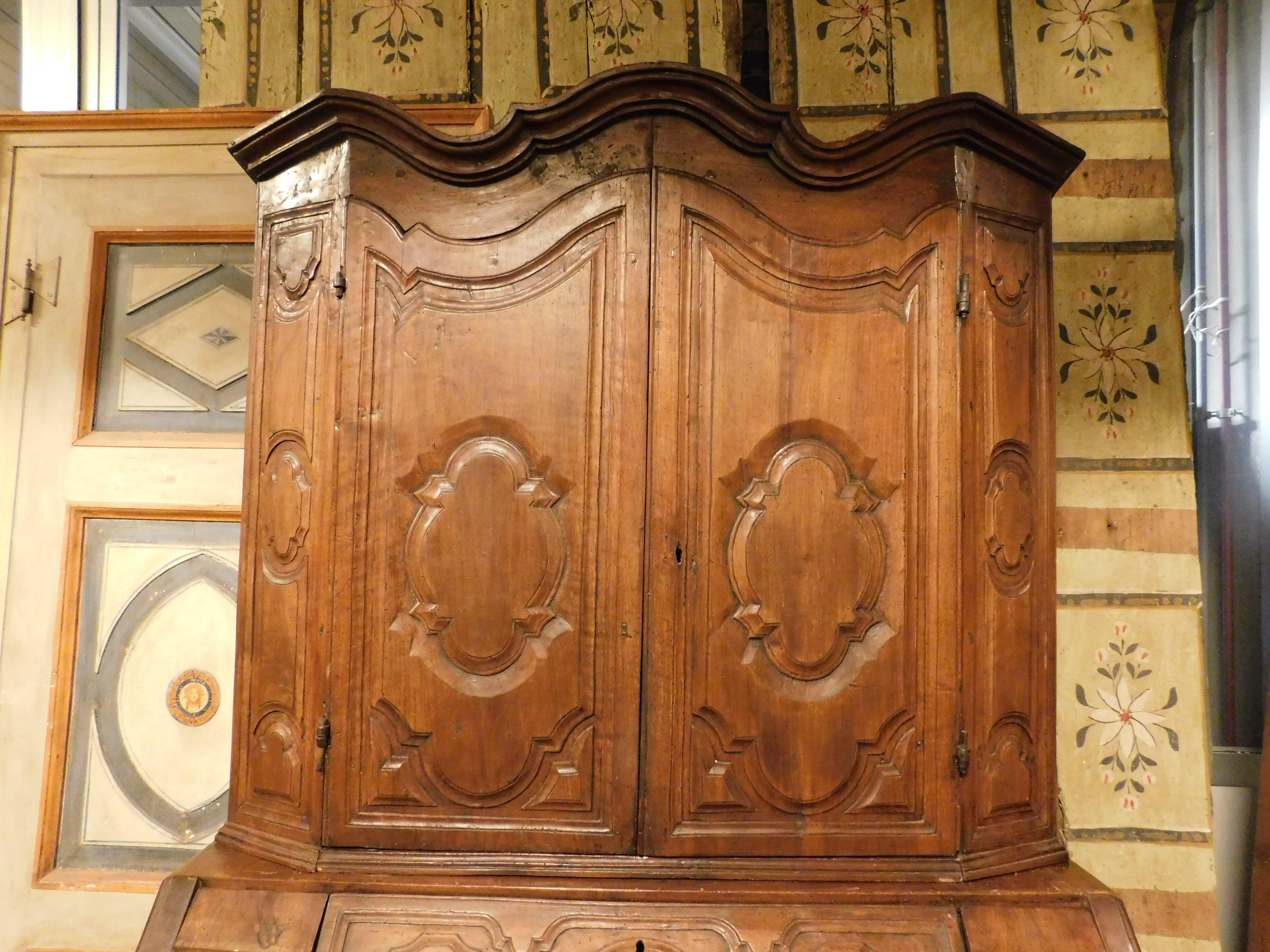 Italian Trumeau, double body in carved walnut with doors, flap and drawers, Italy For Sale