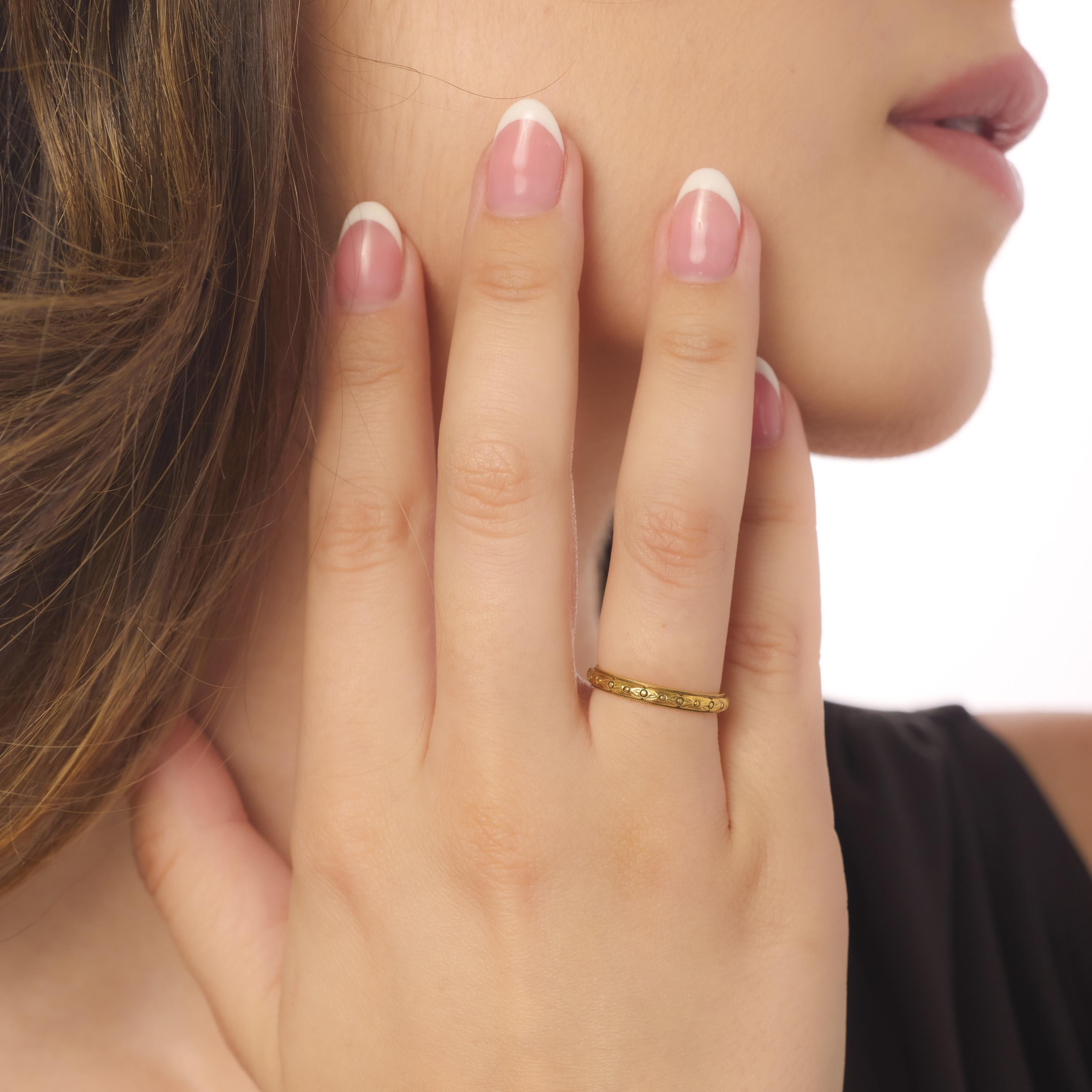 This contemporary eternity band by Trumpet & Horn is crafted in radiant 18k yellow gold, offering timeless sophistication with a modern designer touch. Hallmarked and elegantly minimal, it’s a refined piece perfect for stacking or wearing solo.