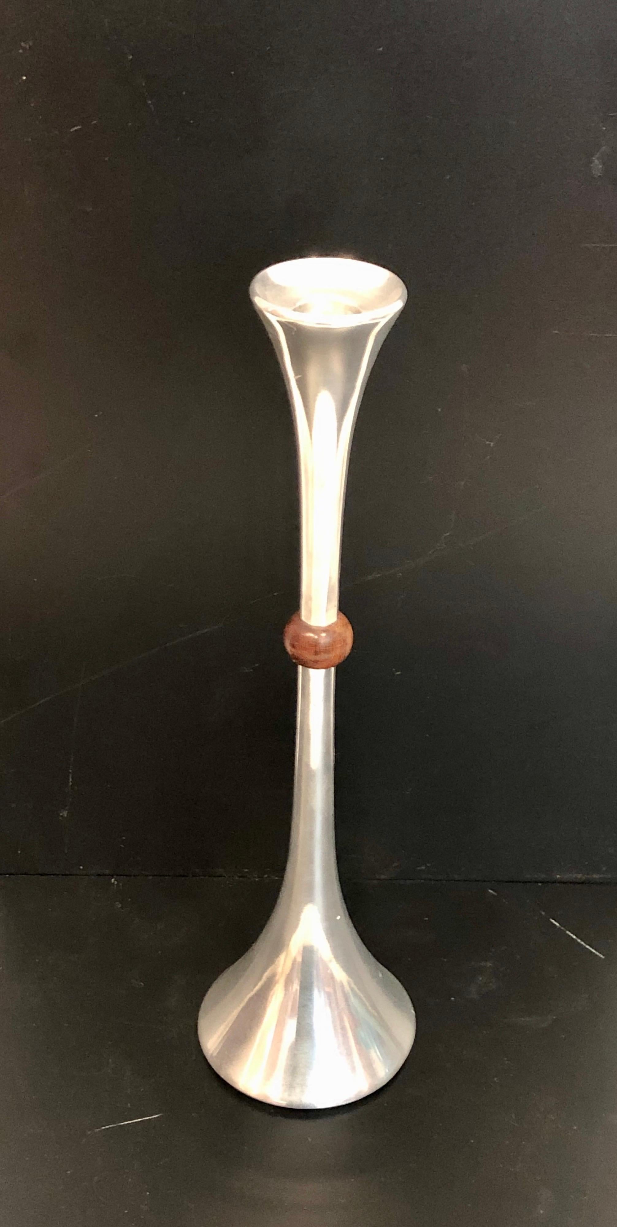 Great design on this tall trumpet shape polished aluminum with solid walnut decorative center, designed by Quistgaard for Dansk.