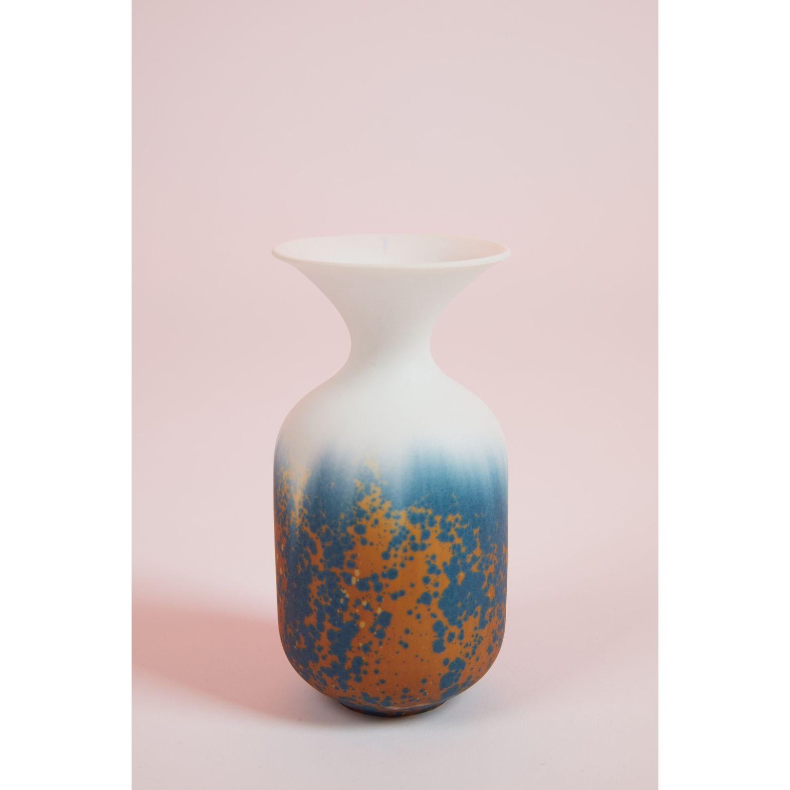 Trumpet vase by Milan Pekar
Dimensions: d x h 10 cm
Materials: Matt Barium Blue Glaze with Nickel Oxide, Porcelain

handmade in the Czech Republic. 

Also Available: different colors and patterns

Established own studio August 2009 – Focus
