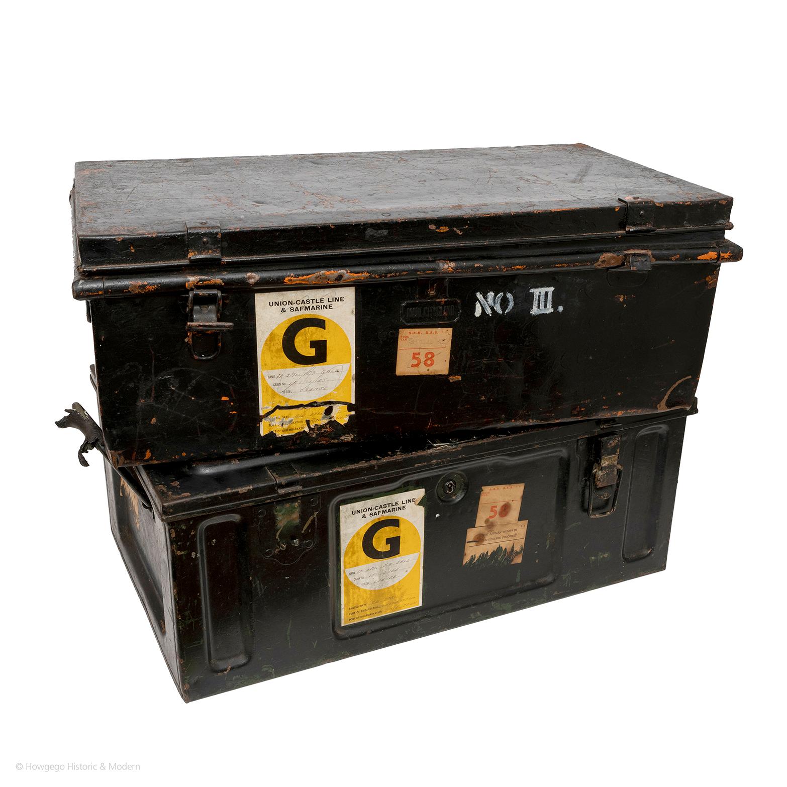 A matched pair of 19th century black metal travelling trunks.  Metal carrying handles.  Locks no keys.  One stamped made in England.  Both with Union-Castle Line & Safmarine, G, Mr & Mrs Gale, Cabin 151 & 155, Vessel SA Oranje, 7th April, Port of