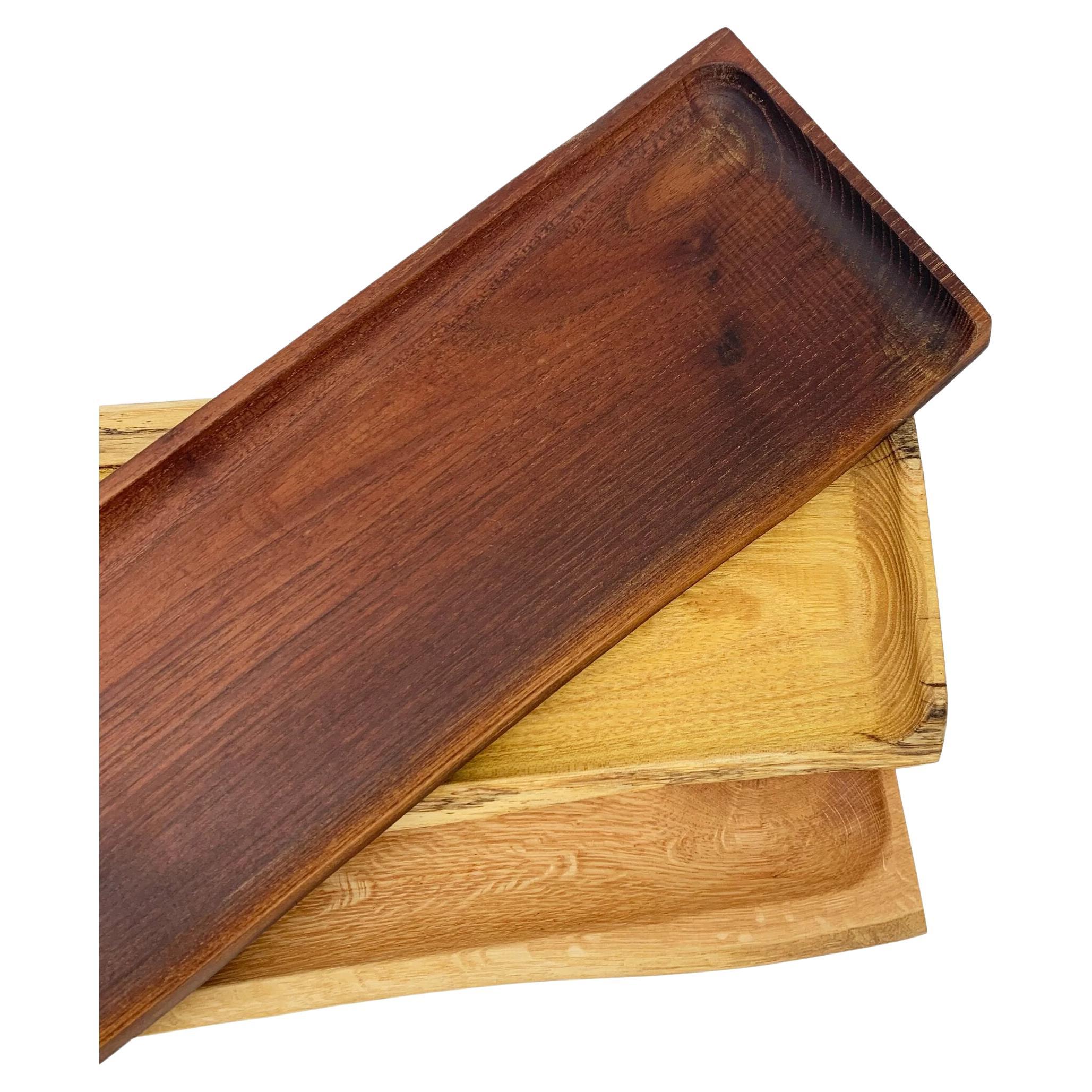 The Trunk Platter is a unique serving board crafted beautifully. With a beautiful natural grain, it brings a touch of nature to any home. Sturdy and durable, it can be easily washed with water and coated with olive oil. Serve up style with this