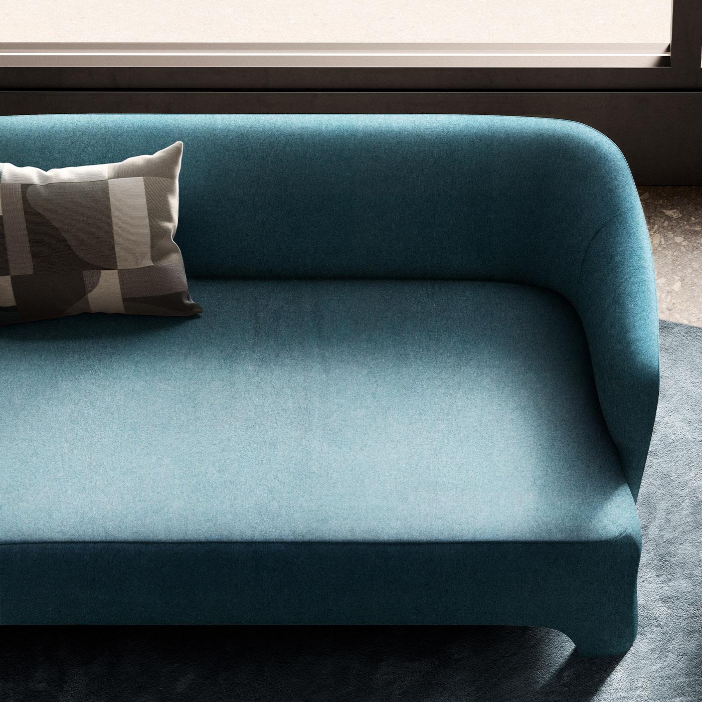 Characterized by a fascinating blue shade of contemporary flair, this sofa is an iconic design by Corrado Corradi Dell'Acqua and an ideal complement to a refined interior. Made of wood and fireproof foam, the structure is entirely upholstered with