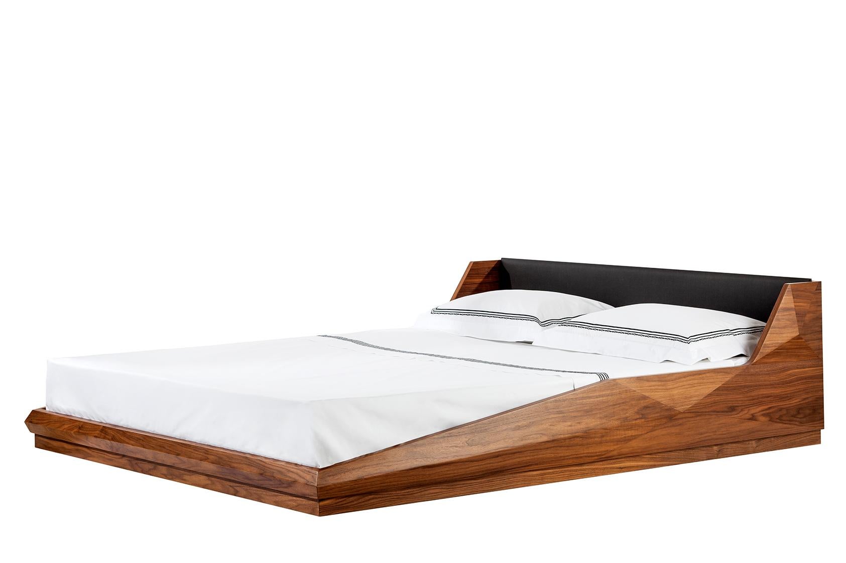 Kontra’s interpretation of the bed.
Convex geometric-shaped walnut/oak body and leather detailed upholstery.

