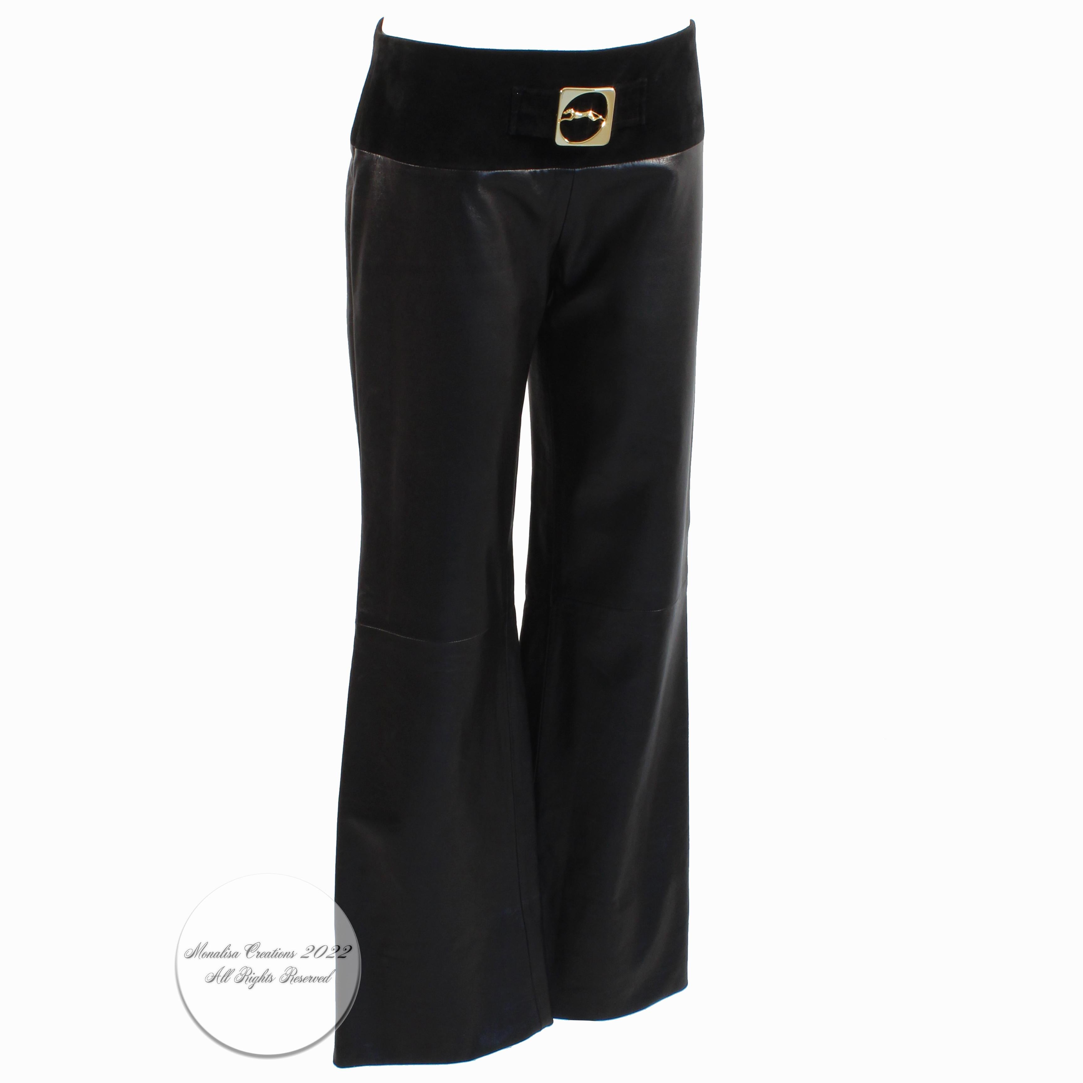 Vintage Trussardi Italy black leather pants with gold logo buckle, most likely made in the late 90s, early 2000s. Made from supple black leather, the waist area is made from black suede and features a decorative gold logo buckle and cinch strap.