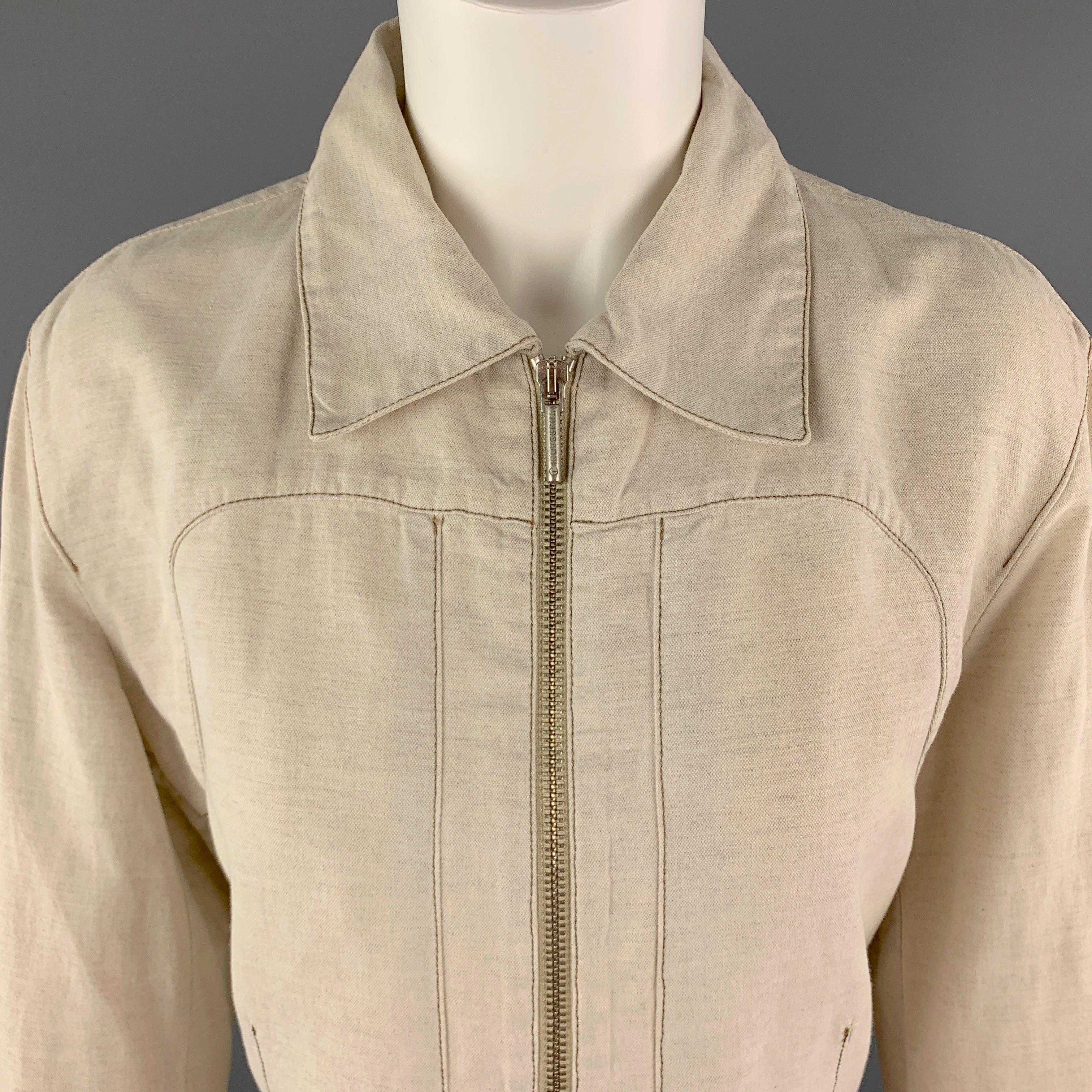 TRUSSARDI Jacket comes in a beige tone in a solid cotton / flax material, with a spread collar, contrast stitch, zip front, unbuttoned cuffs, belt at back, unlined. Minor wear, with marks at back. Made in Italy.
Very Good Pre-Owned Condition.