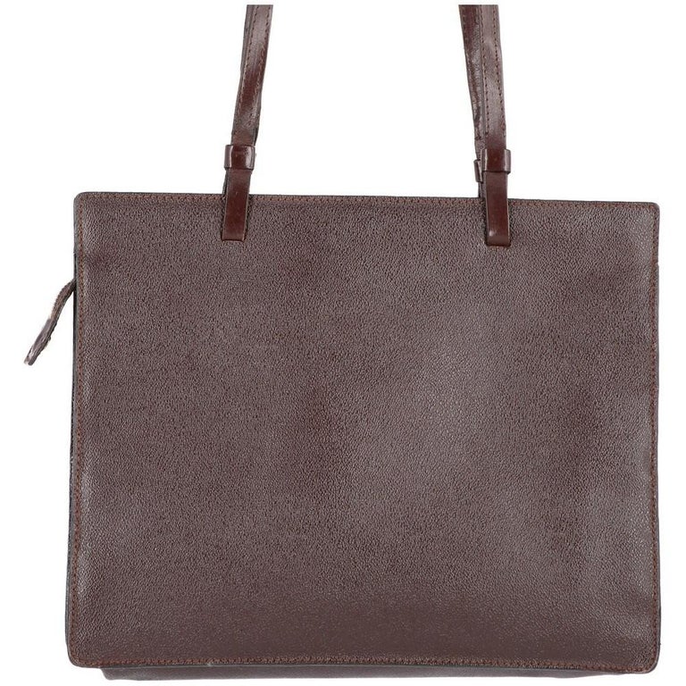 Trussardi brown leather 80s shoulder bag. Solid natural grain rectangular design, double handle, front logo and zipped fastening. Suede lining and one inner pocket.

Measurements
Height: 25,5 cm
Width: 32 cm
Depth: 8 cm
Handle height: 89 cm

Product